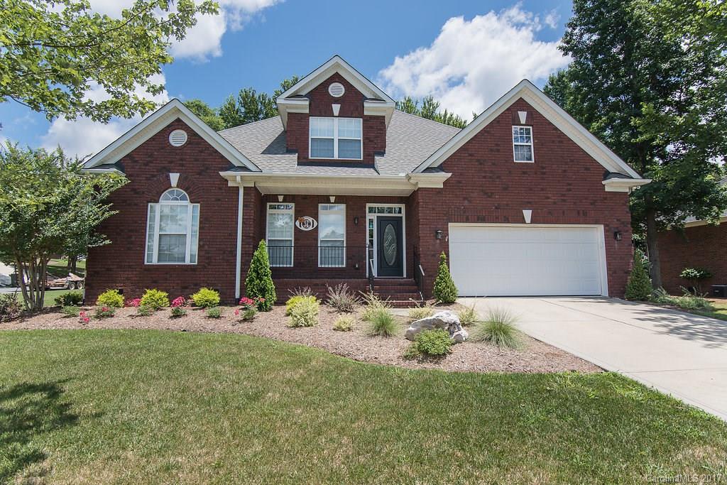 Hard to find beautiful all brick ranch on a corner lot! This immaculate 4 bedroom/ 3 bath home boasts all new hardwoods and carpet throughout the downstairs, new back patio, open floor plan with arched openings, irrigation system, large screened porch and a large master on the main floor with double vaulted ceilings! Upstairs bedroom could also be a second master suite. Do not miss out on this one!