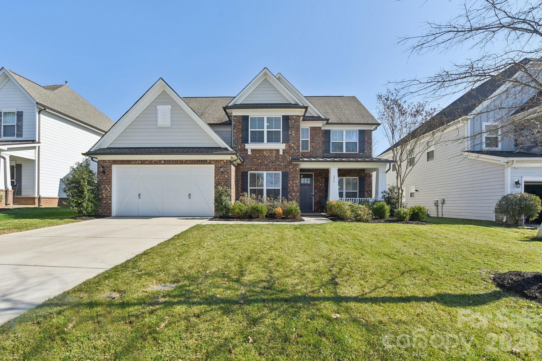 This 5-bedroom, 3.5-bathroom masterpiece in the Habersham community offers a perfect blend of luxury and functional design. The spacious main-level primary bedroom features a striking trey ceiling, a massive walk-in closet, and a deluxe bath suite with double vanity & unwind in the spa-like shower after a long day. The culinary hub is equipped with a gas cooktop, kitchenaid in-wall oven and microwave, elegant granite counters, a large island, a walk-in pantry, and a vented exhaust hood. Host formal dinners in the dedicated dining room showcasing a trey ceiling & moldings, or utilize the butler's pantry with a beverage refrigerator and breakfast room for more casual gatherings. A unique meal planning station and a dedicated home office make daily organization effortless. The great room is open to the kitchen with gas fireplace showcasing a beautiful stone surround. New 9" Mokawk engineered flooring, updated paint and beautiful moldings add an elegant touch to this stunner. The second floor opens to a large loft, ideal for a media room or playroom. You'll find secondary bedrooms spacious with walk-in closets, two full bathrooms, and walk-in storage. Relax under the pergola patio or on the custom paver patio. The yard features an irrigation system and newly fenced yard. The tandem 3 car garage with epoxi floor & EV charging station has ample space for three vehicles or extra storage and a workshop area. The easy connectivity to shopping, dining, parks & entertainment along with the community pool, playground, walking trails & sidewalks makes Habersham a wonderful place to call home!