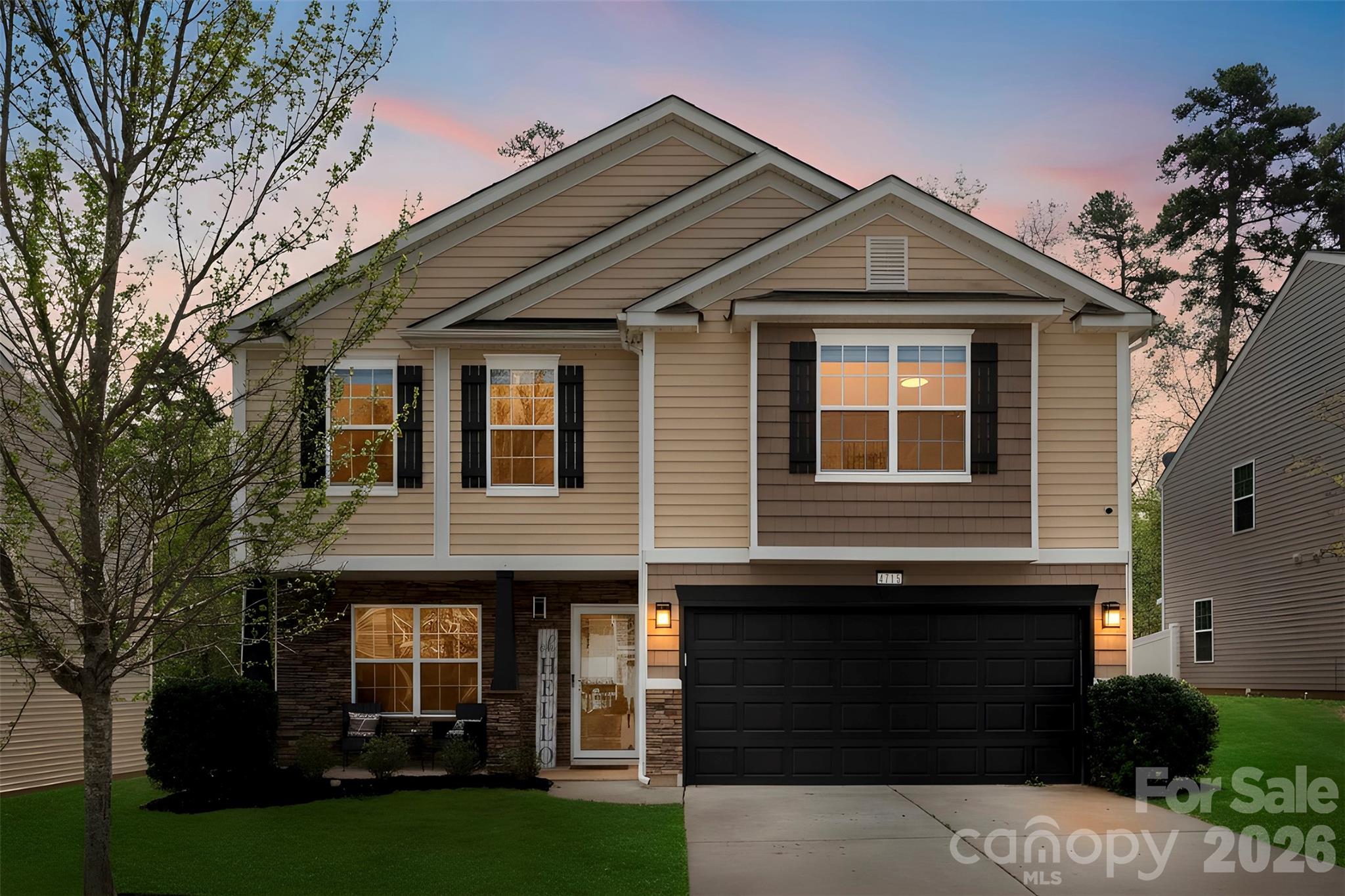 Reduced Price for a quick sale! Eligible for 0% down, No PMI, and 10K lender credit with preferred lender. Welcome to this beautifully upgraded 4-bedroom, 2.5-bath home in the desirable Northlake Landing community — where location meets lifestyle. Situated just 15 minutes from Uptown Charlotte and only 2 minutes to I-485, you get the convenience of the city without sacrificing privacy. Step inside to an open floor plan bathed in natural light, featuring luxury vinyl plank flooring throughout the main level. The kitchen is the heart of the home — fully upgraded with an expanded quartz island perfect for entertaining, a gas range, pendant lighting, and ample pantry storage. Upstairs, the spacious primary suite impresses with vaulted ceilings, a generous walk-in closet, and a private en-suite bath. All three additional bedrooms are larger than average with oversized closets — great for families, guests, or a home office. Step outside to your private retreat: a fully extended patio and built-in fire pit backing up to mature privacy trees — your own backyard escape. Additional highlights: newer carpet upstairs, epoxy-coated garage floor, and close proximity to retail shopping and everyday conveniences. This one truly checks every box. Schedule your showing today!