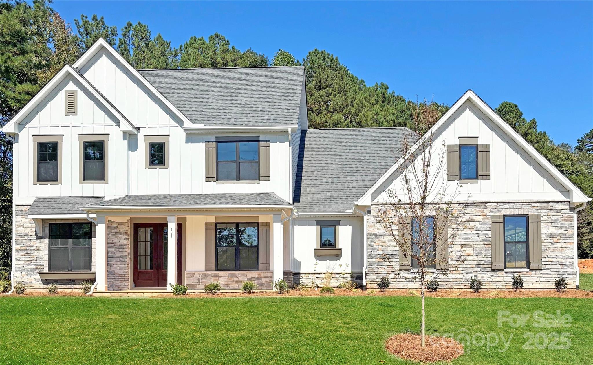 This spacious two-story home is designed with both functionality and flexibility in mind. The main level features a private primary suite with dual vanities, a large soaking tub, and a walk-in shower—offering a true retreat at the end of the day. A flexible front room and a secondary bedroom add even more livability. A main-floor powder room is perfectly positioned for guests. Upstairs, you’ll find a generous bonus space, two additional bedrooms, a full bath, and a second powder bath—ideal for entertaining, everyday routines, or weekend guests. You won't want to miss the large screened porch with floor to ceiling fauxstone fireplace. This is the perfect space for both entertaining and unwinding after a long day! 
Saddlehorn is conveniently located 10 minutes from I-77, near both Charlotte and Mooresville. Lake life is just around the corner, with boat storage and access to Lake Norman less than a mile away, making it easy to enjoy weekends on the water. Indulge in the expansive private homesites that offer both serenity and space, making this the perfect place to call home!