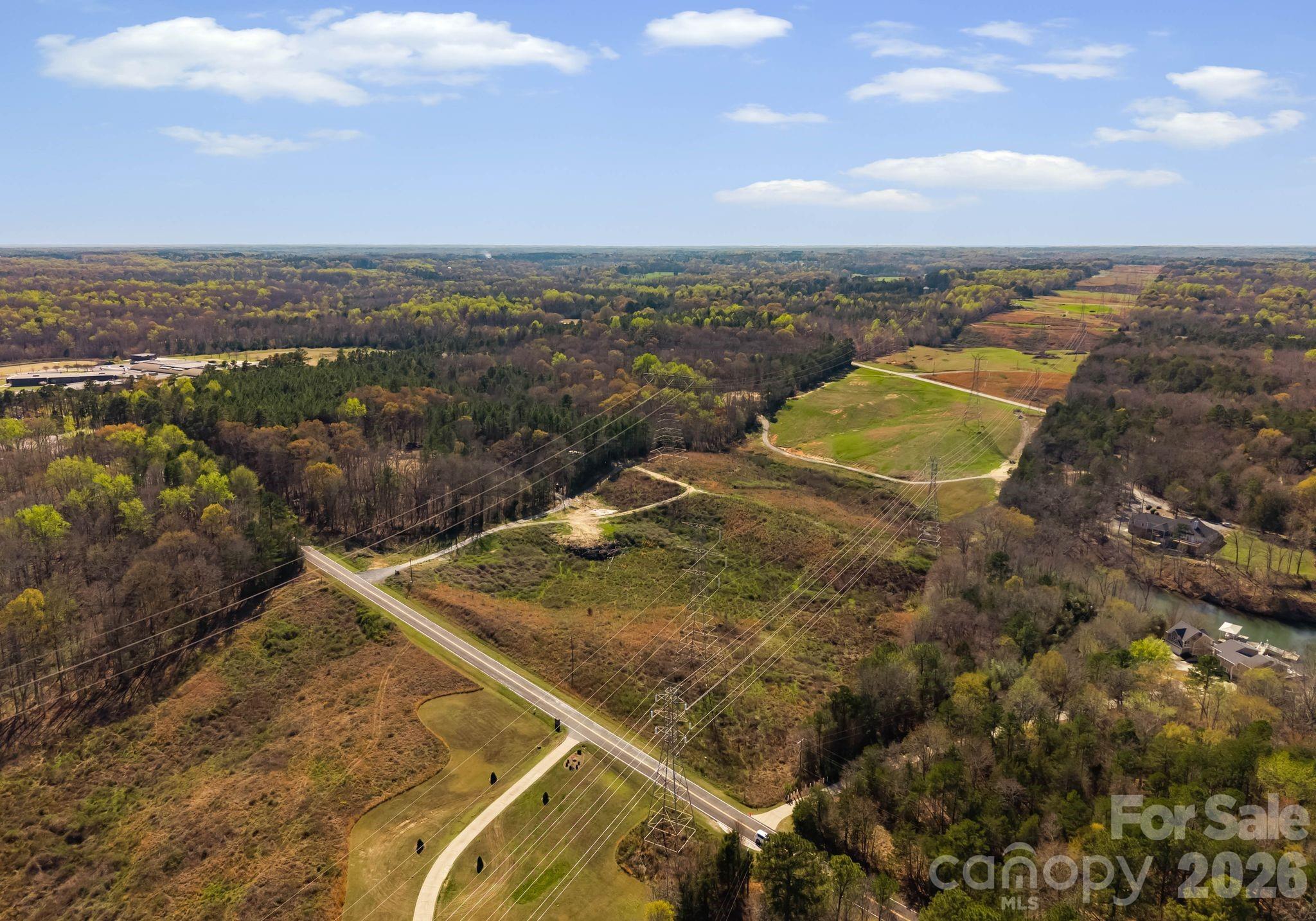 Discover the possibilities with this 18+ acre property in Rock Hill offering space, privacy and flexibility. The city of Rock Hill has zoned this parcel RU,  this expansive tract is ideal for those looking to have private home, establish a small farm, create a homestead, or invest in land in a growing area. Enjoy peaceful surroundings while still being just minutes from the conveniences of  Rock Hill and Lake Wylie as well as having a short drive to Charlotte.