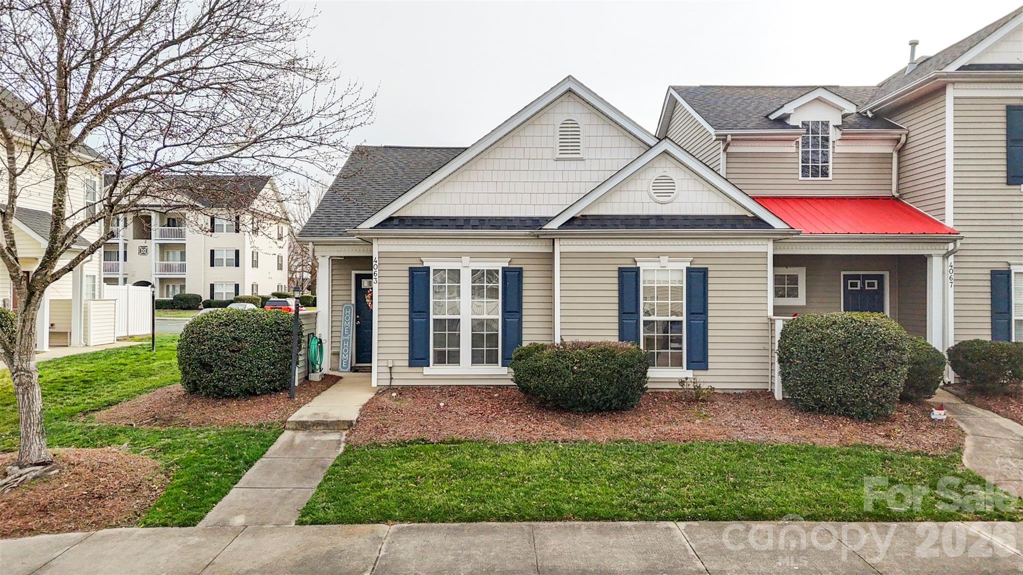 Hard-to-find single-level end-unit townhome located directly across from the community pool. The open living and dining area with fireplace offers a comfortable space for everyday living and entertaining. The primary bedroom includes a private bath and walk-in closet, while the secondary bedroom offers flexible space for guests or a home office. Enjoy morning coffee or relax in the evening on the private back patio. New carpet adds a fresh update, and the home offers an opportunity to personalize with your own style. HOA dues include water, trash/recycling, lawn care, and community amenities. Conveniently located within walking distance to the Harrisburg Family YMCA, grocery shopping, restaurants, and coffee shops. Per HOA, there is an approximate 5-year wait list for rentals.