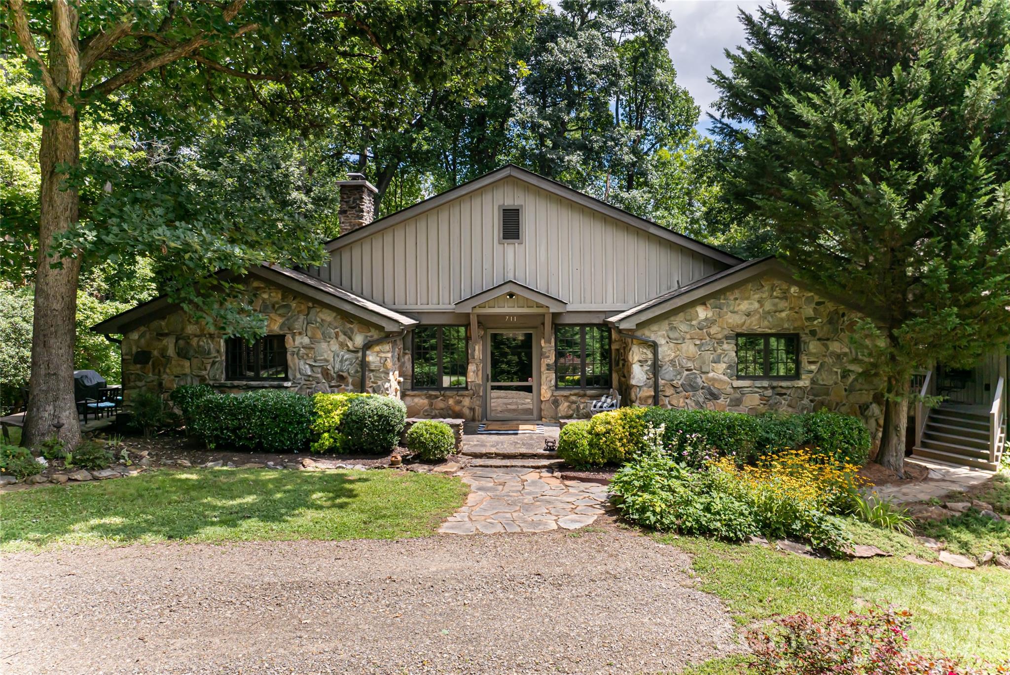 Just three miles from the heart of downtown Asheville, this exceptional property offers a rare opportunity to either create a family compound or a new residential development project. Spanning over 12 acres, this sprawling estate combines end-of-the-road privacy with the convenience of being moments from downtown Asheville. The existing estate includes a main house with all the charm of a 1930s home that has been completely updated, a guest cottage ideal for guests or a caretaker, and a three-car, air-conditioned detached garage with apartment/living space above it. The home's position on the property allows for multiple development options. The existing estate could stay as is and the additional eight acres (approximately) could be developed, or the entire 12-plus acres could be developed. Buyer to confirm utility connections for development purposes and development potential with City of Asheville. Please see attachments for more development information. One of the few remaining large parcels available for development within Asheville city limits. No drive-bys as home not visible from road and driveway is gated. An 8.87-acre adjacent property is also available for purchase, see MLS #4331437. The address is 67 Shawnee Trail.