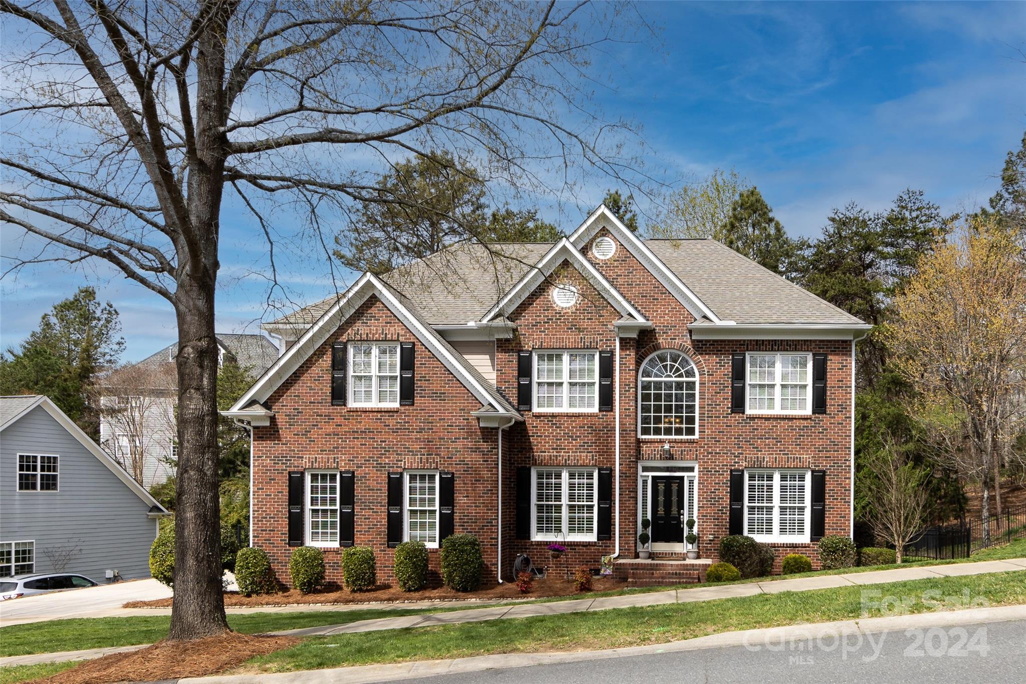 Stunning home in the highly desirable Lake Shore community in the heart of Tega Cay! When entering the home you are greeted by a welcoming foyer and two office/flex spaces with French doors that are perfect for working from home. This meticulously maintained house showcases recently refinished hardwood floors throughout the entire downstairs living area, plantation shutters, an abundance of professional trim work and a butler’s pantry. The spacious kitchen displays high level granite countertops and gas cooktop while overlooking the impressive family room with a fireplace and gas logs. New carpet is featured upstairs along with 5 large bedrooms including the primary with a tray ceiling, sizable bathroom and closet. Recently installed Trex decking overlooks the large, beautifully landscaped, mostly flat yard which is a rare find in Tega Cay. Freshly painted exterior fiber cement, new roof in 2019, wrought iron fence, full yard irrigation and a tankless water heater.