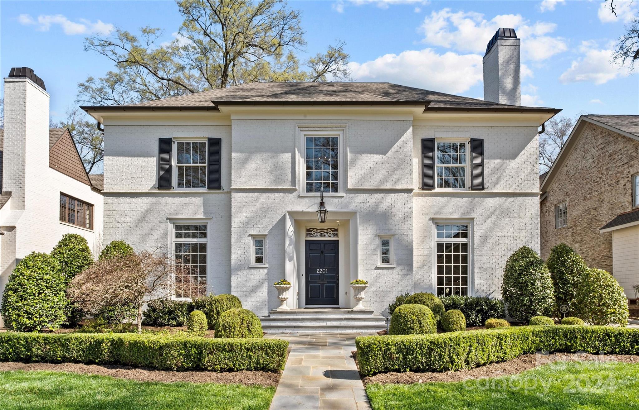 LUXURY LIVING IN MYERS PARK! This spectacular custom home, designed by Greg Perry Design & built by Knight Residential Group, exudes luxury & sophistication. Desirable floorplan for effortless entertaining & everyday living. Unique, custom & high-end finishes throughout. Spacious living rm w/fireplace & beautiful dining rm. Show-stopping chef’s kitchen open to a fireside family rm, wet bar w/svc opening to foyer, & large sunny breakfast rm. Side entry w/drop zone & built-ins. Primary suite on upper w/ensuite bath featuring double vanity, shower, soaking tub & walk-in closet. 3 addt'l bedrooms w/ensuite baths & large laundry rm on the upper. Bonus rm, 5th bedroom & full bath on the 3rd level. Guest suite/bonus rm w/a full bath over the detached 2-car garage. Extend entertaining outdoors on the screened porch w/fireplace & covered porch w/built-in grill, overlooking the private backyard w/gorgeous landscaping. This stately home is convenient to shops & restaurants in the Myers Park area.