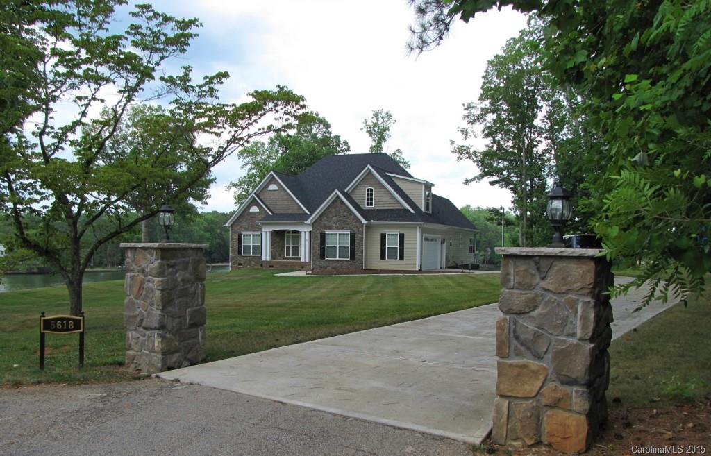 Lake Wylie living at its best! Prime waterfront lot. 1.13 acre. Spacious, open custom ranch with Bonus up. Fabulous views. Great room with coffer ceiling. Stainless kitchen with large island, desk, and easy close drawers.  Huge Dining area. Large Master with luxury bath and dual custom closets. Roomy sec bdrms.  Plantation shutters. Walk in attic storage.  Screen porch. 2 elevated decks.  2 docks (1 covered).  325 feet of rip rap shore line.  Mostly flat yard with back gentle slope to lake.
