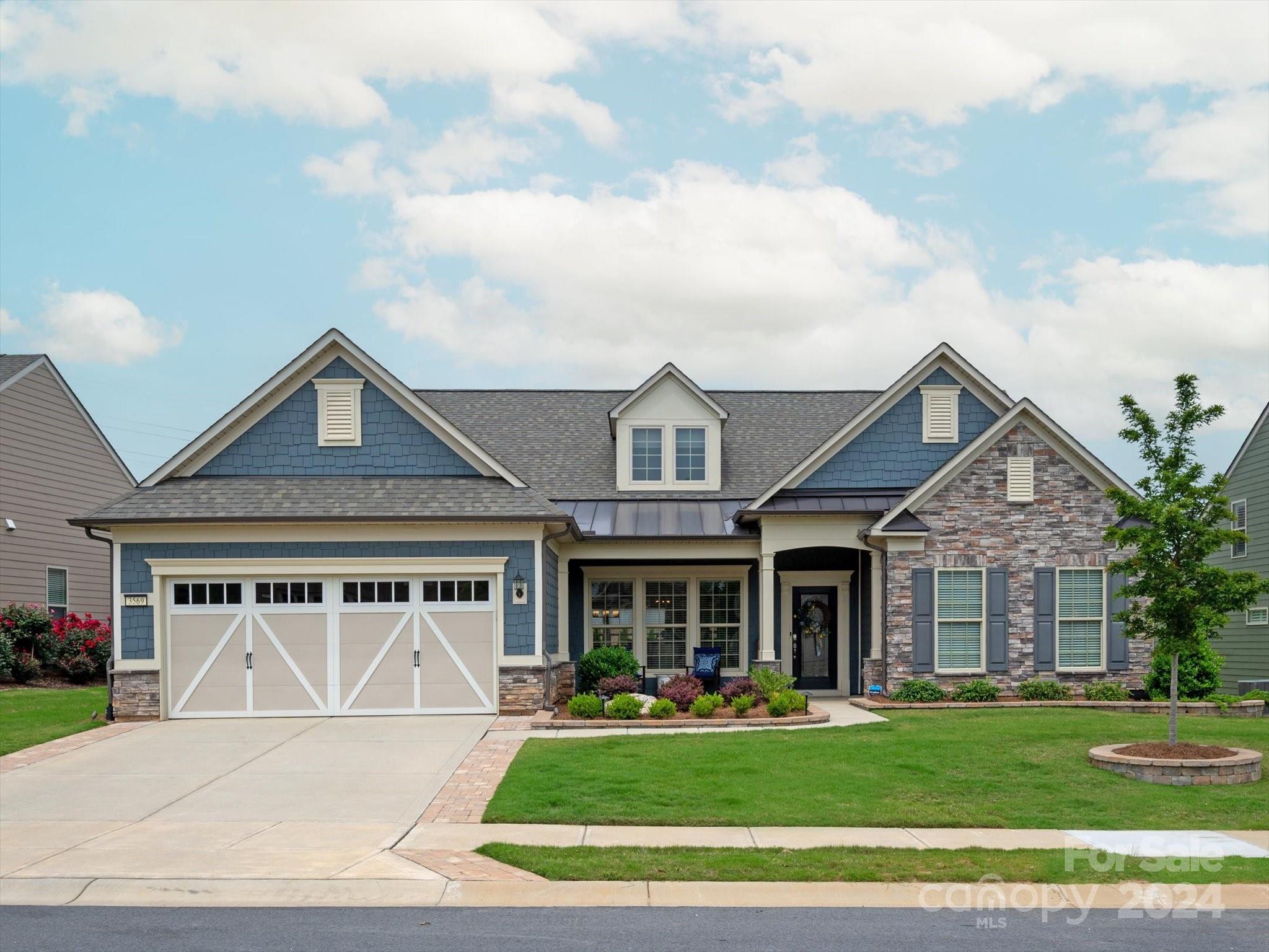 Welcome home to this stunning Customized Carolina Orchards (Fort Mill, SC) 55+ Community home. Enjoy resort style living in this Cul-de-sac location w/your own personal putting green in the backyard; extended paver patio; built in outdoor Bull Gas grilling station;custom boulder water feature & screened back porch. The perfect open floorplan for entertaining all your guests. Primary on main level as well as an add'l guest suite w/full bath & seperate office. Upstairs you will find a spacious loft & an add'l bedroom (currently used as a movie room) & a full bath. Too many upgrades to list fully: Stacked stone fireplace and Custom built in bar w/bev fridge in GR;Ext. kitchen island & bar seating; soft close drawers & pull out shelving;Quartz countertops; touchless Kitchen faucet; custom built in pantry and closets throughout; Epoxy flooring in garage; tankless water heater; & walk-in storage. Amenities: Indoor & Outdoor pool; full gym; activity clubs; tennis & pickleball courts and more.