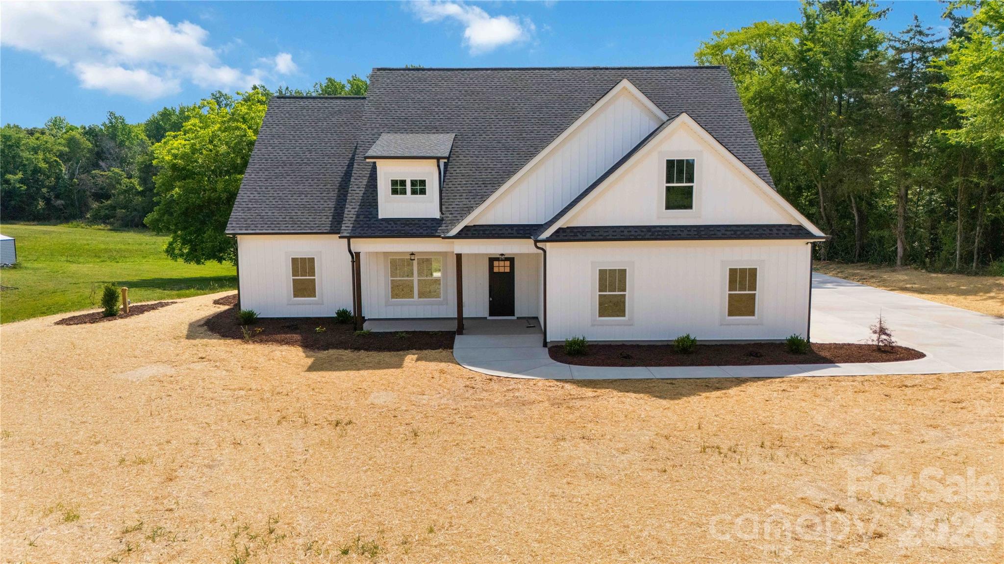 Modern and luxurious new construction waiting for you to make it a Home!  From the ground up on this sprawling 2.5-acre lot with a gorgeous tree-lined backdrop, this house has been expertly crafted.  Opening the front door, natural light shines in on the expansive open floor that was designed for hosting grand gatherings or finding quiet moments of relaxation by the fireplace.   A large island with a rustic base, stylish pendant lighting, and plenty of room to create those favorite dishes in this beautiful kitchen.  Imagine the restful sleep you will have in this grand primary retreat with an ensuite, and that walk-in closet is set up for easy organizing.  2 additional bedrooms and a full bath round out the main level.  The living space continues upstairs with a sizable loft and bonus room, another bedroom, and a full bath!  A covered back patio that has a beautiful view, where you can just sit and listen to the tranquil sounds of country living.  Your home searching stops here - Welcome Home to 352 Adams Road!