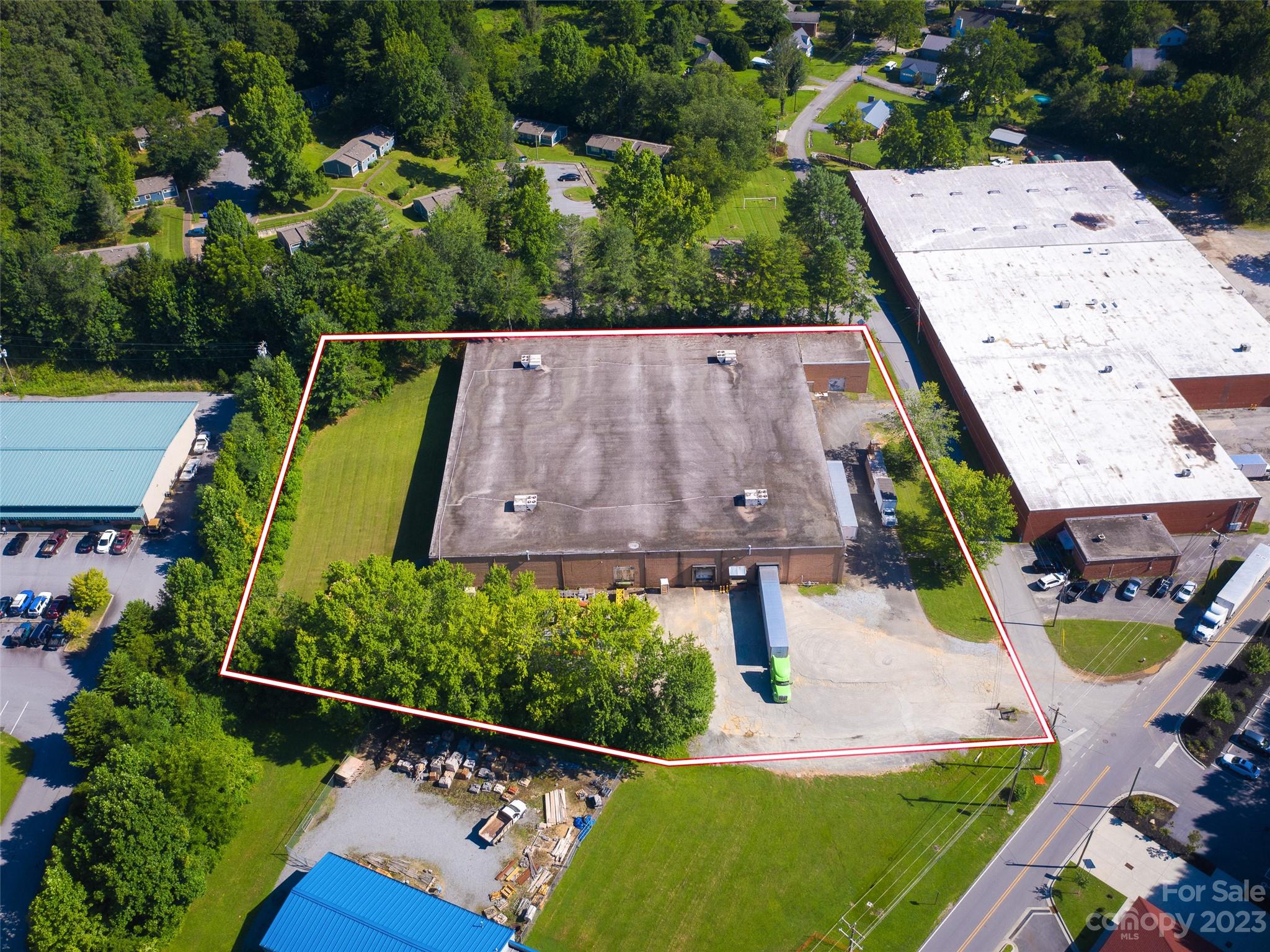 Do not miss out on this highly flexible 41,600sf warehouse/manufacturing facility.  With an open interior, the space features 25'x33' column spacing, 20' ceiling height, three dock doors, two roll up drive-in doors, and room to expand the structure if needed.  The building is sprinkled and has 3 phase 208v power, natural gas, sewer and water.  The building sits on 2.44 acres directly across the street from Depot Park and the Estatoe Trail.  The current tenant plans on vacating in the coming months so the building would be delivered vacant. For a user creating jobs there may be a variety of local and state grants available for building reuse, development, Duke Energy rider, and employee training.  The property is conveniently located in the highly desirable community of Brevard and less than 1 mile from the bustling downtown. This property did not receive any notable damage from Helene and is available immediately.
