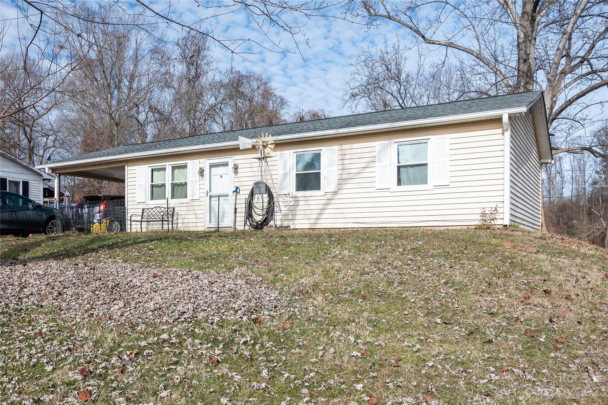 Own this 3 bedroom home for less than rent.  Interior needs cosmetic updating throughout and could be lived in while personalizing it and making it your own.  Don’t miss this affordable home located in Troutman NC with easy access to interstates and Charlotte.  This  3 bed 1.5 bath has a new roof and new windows within the last year.   New vinyl plank flooring in the family room.  Laundry is located in the eat in kitchen.  Convenient 1 car carport with plenty of additional parking in the driveway. Great location close to  library, middle and elementary schools, dining and walking trails. Sellers to make no repairs.  Home is being sold “as is”.