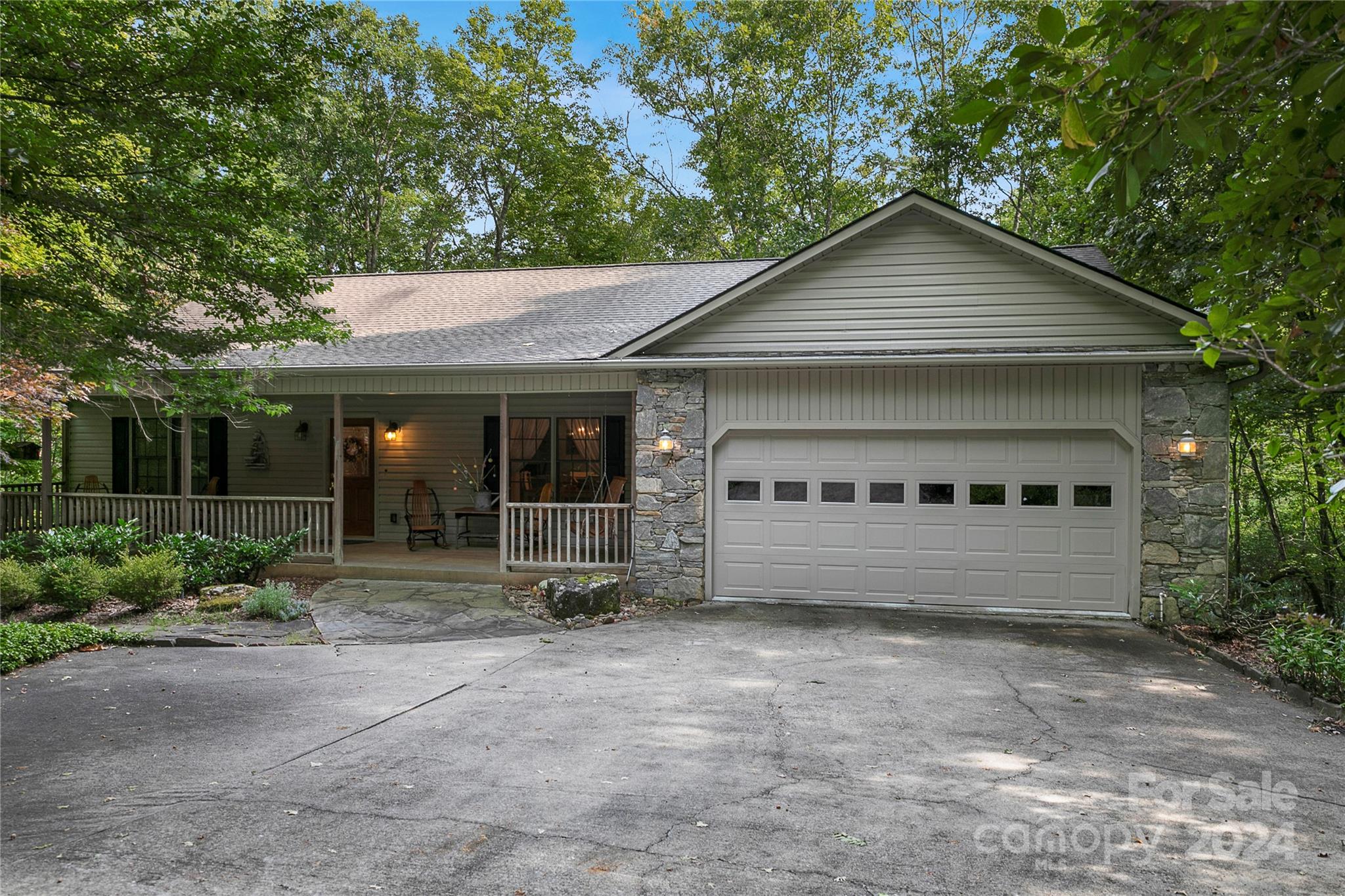 This exceptional home is being offered as a turn key experience. Truly a tree house, 76 Dvga was a custom build for the original owners. With generous sized living space, a remodeled kitchen in 2016 with quartz countertops, new zoned HVAC systems in 2023 and an amazing finished bonus area in the basement for whatever your heart desires, this home has it all. Single level living and easy access are just a bonus to this beautiful home. The outdoor space includes a welcoming covered front porch, a 3 season sun room overlooking the beautiful mountain laurel forest, and a large lower deck off of one of five bedrooms and the awesome bonus room. The location can not be beat with a level road to the driveway, and a quick drive to the Clubhouse, Lake Atagahi Park and the East Fork Entrance. At the end of a private street and overlooking common area, peace and quietude is at its best. First time home buyer pays $13,000 amenity fee at closing or $15,000 at the end of the year