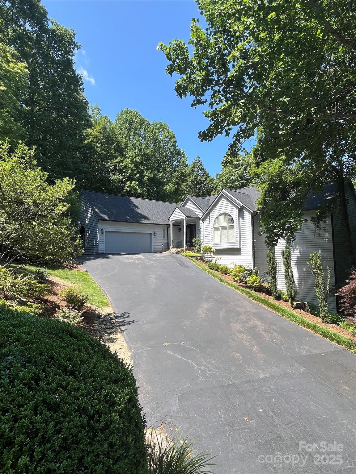 Beautiful updated estate home in Kenmure. Main level has open floor plan with mountain views. Great room has vaulted ceilings, large windows, fireplace with gas logs and formal dining. Gourmet kitchen is equipped with stainless steel appliances, walk-in pantry and keeping room. Primary bedroom has luxurious spa like bathroom and large walk-in closet. Office and laundry also located on main level. Lower level has family room with pool table, fireplace with gas logs, two guest bedrooms and three full bathrooms. This home is being sold furnished. Natural gas generator for peace of mind. Kenmure Charter membership included!