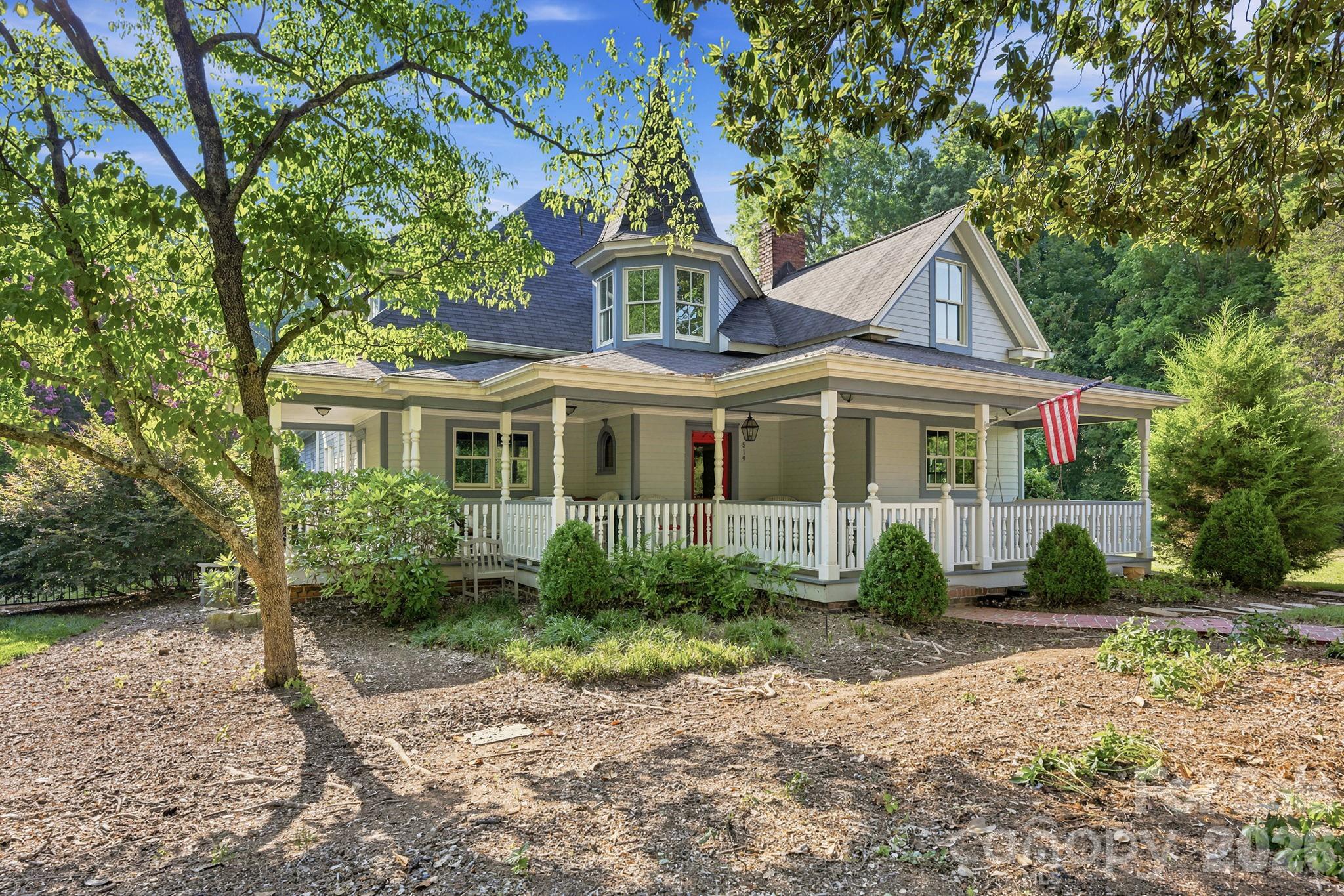 Historical significance meets rare walkability. This remarkable turn-of-the-century Victorian home was completely renovated and expanded in 2013 by Fine Homes Inc. At that time, the detached garage, with a two bedroom apartment, was also added to the property. This wonderful four bedroom, three full bath home sits on a 0.62 acre lot, just a few blocks from village center and one block from Davidson Elementary School. During the renovation, all new energy efficient windows were installed, the insulation was improved, the electrical system was replaced, and the home was brought up to modern standards while paying homage to its historic roots.  The rear part of the home, overlooking the woods, is bathed in natural light from additional windows, doors and skylights that were added in 2013. The gourmet kitchen is a chef's dream with marble countertops, stainless appliances and a large island. The original hardwood flooring was revived and then matched where space was added. The owner's retreat consists of a sitting room, bedroom, spacious bath, and double walk-in closets. Including the detached garage's apartment, the entire property boasts 6 bedrooms and 4 full bathrooms. This is a unique opportunity to own one of Davidson's loveliest historic properties. Welcome Home!