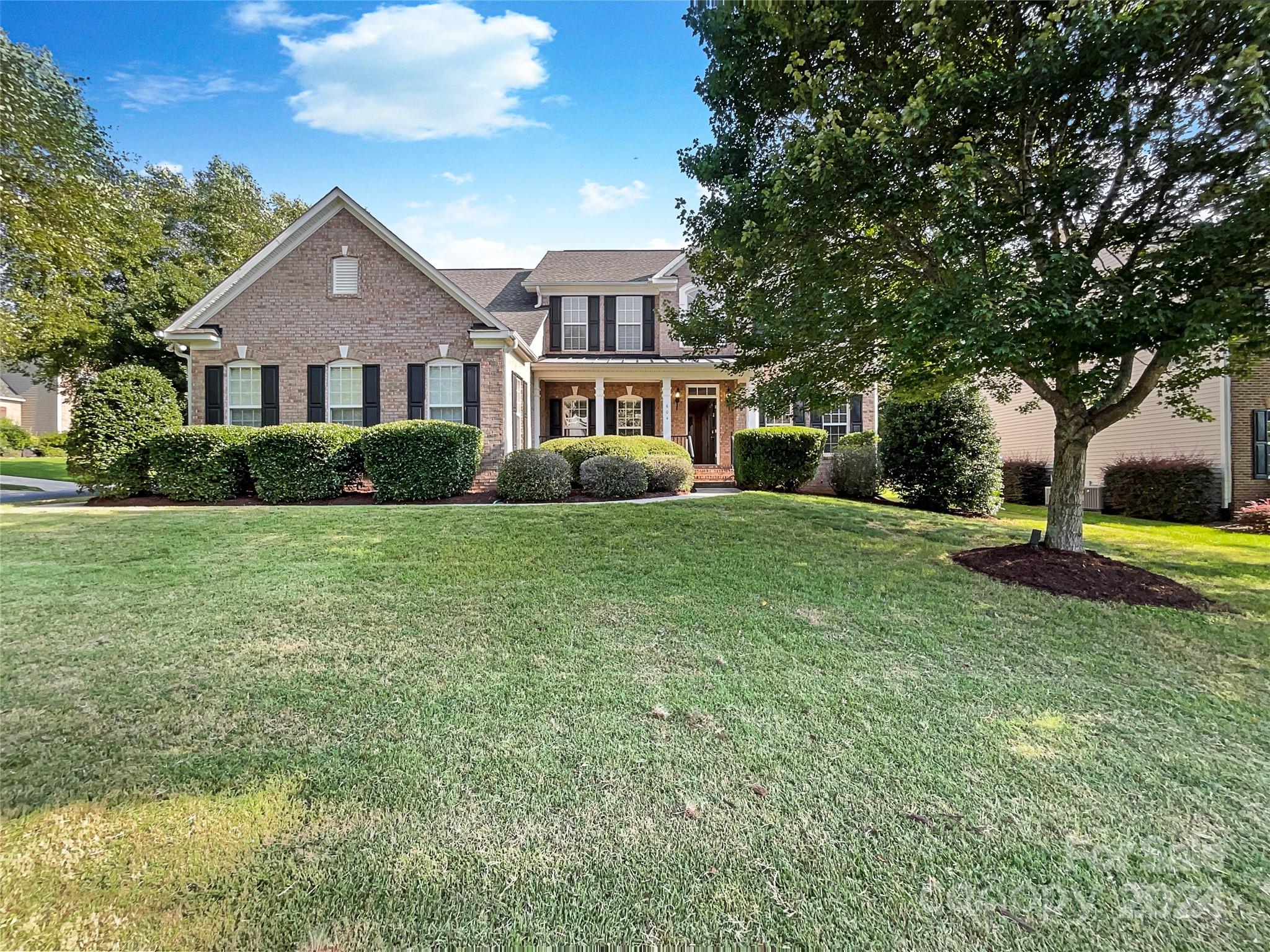 Seller may consider buyer concessions if made in an offer. Welcome to your dream home where luxury meets comfort. The interior features fresh paint that enhances the natural light in every room. The living area includes a cozy fireplace for chilly evenings. The kitchen, with its accent backsplash is a chef's delight. The primary bedroom offers a walk-in closet, and the bathroom includes a separate tub and shower for relaxation. Enjoy the beautiful deck and patio, perfect for entertaining or a quiet morning coffee. This home blends elegance and functionality—don’t miss the chance to own this piece of paradise.