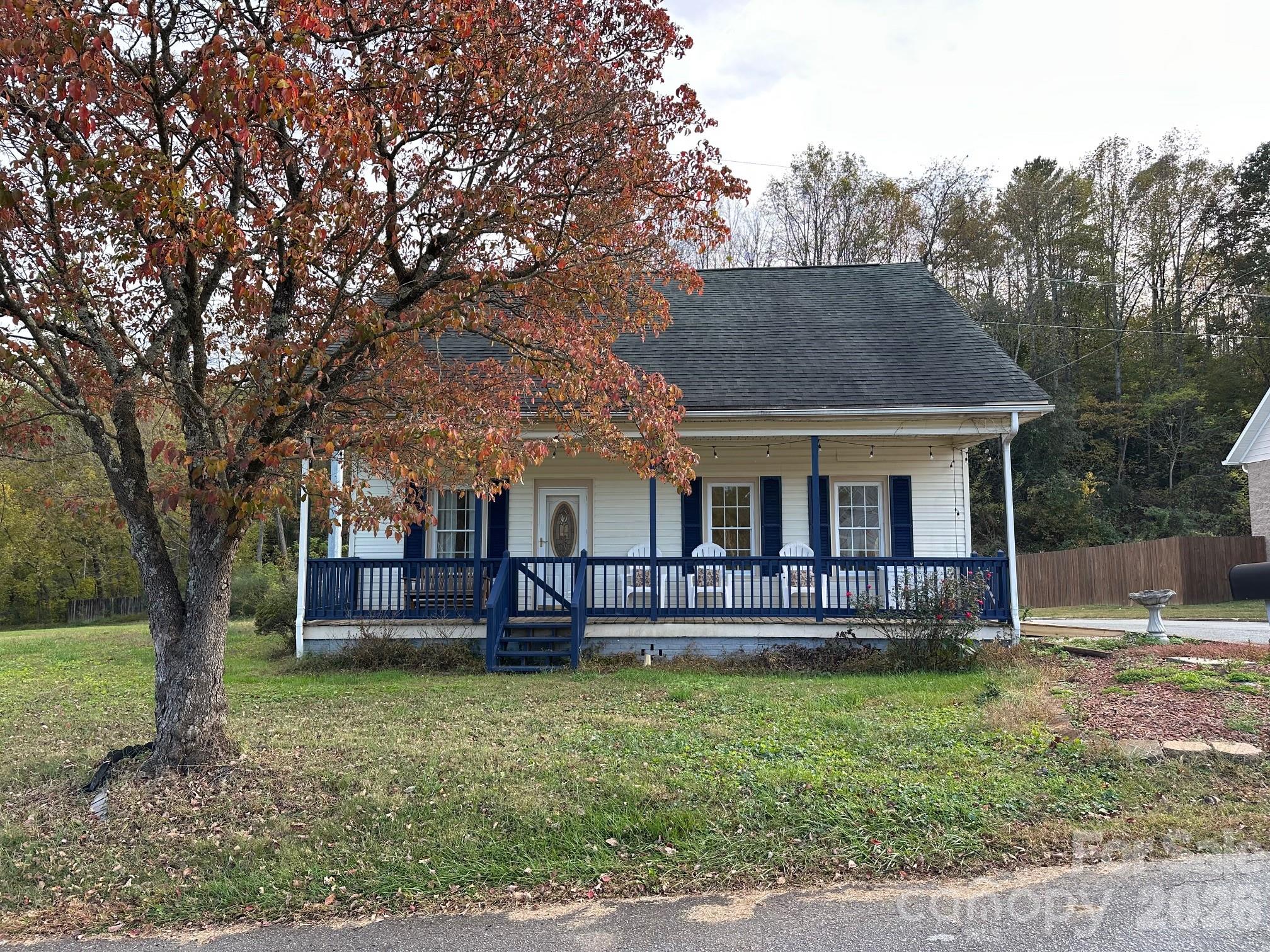 LAKE VIEWS YEAR ROUND at this adorable turn-key turn of the century cottage on highly sought Lake Rhodhiss. Public boat ramp located at street entrance from Burke Street, across from popular neighborhood haunt Copper Penny Grill, and next to Horseshoe Trail Park, just 12 mins to Downtown Hickory and 8 mins to I-40 for easy regional commutes. Home features refinished original oak hardwood floors, and generous 9 foot ceilings. Rear bedroom provides access to the remodeled full bath with claw foot tub. Wide front porch to enjoy lake views from across the street, and rear deck for firing up the grill. Low maintenance yard, public street access, dead end road so mostly local traffic. All electric home systems and appliances, city water and sewer, on street waste pickup all for lower Rhodhiss property tax rate. Truly affordable option for smart buyers, with peace of mind from these 2025 improvements: new HVAC air handler and condenser, new and reinforced piers and floor joists where needed, new subfloors and refinished hardwood floors, new crawlspace vapor barrier, kitchen: new quartz counter top, new sink, new appliances, refinished cabinets, bathroom fully replumbed with new cast iron, tile floors, new fixtures and claw foot tub, front porch and shutters painted, new water heater. This is the one.