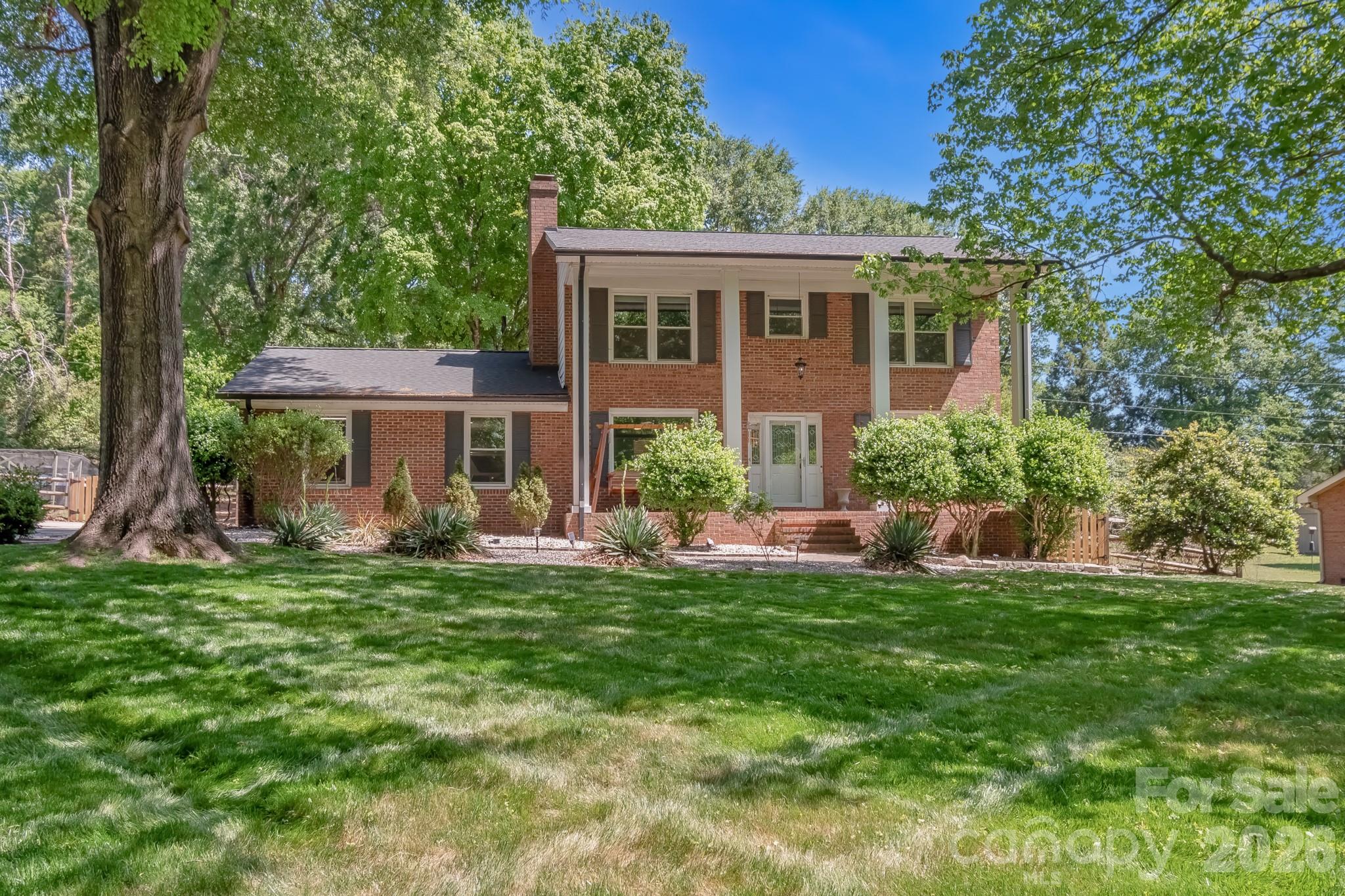 1% FIRST-YEAR RATE BUYDOWN + $2,000 PREFERRED LENDER CREDIT! Rare opportunity in highly sought-after Quail Hollow! This beautifully updated all-brick home sits on over half an acre with NO HOA, offering the perfect blend of privacy, space, and convenience in one of Concord's most desirable locations.

Set back from the road with an extended driveway, you'll enjoy exceptional curb appeal, abundant parking, and a peaceful setting. Inside, natural light fills the home through oversized windows with a lifetime warranty, showcasing two spacious living areas, a formal dining room, and flexible spaces ideal for entertaining or everyday living.

The inviting family room features a cozy gas fireplace with custom built-ins, while custom closet systems throughout the home add stylish, functional storage. Step outside to a fully fenced backyard perfect for entertaining, gardening, pets, or simply relaxing. The irrigation system keeps the front lawn looking its best, and gutter guards provide easy, low-maintenance living.

Major updates include a 2021 roof, 2025 water heater, gutter guards, newer microwave, refrigerator, washer, and dryer. Combining timeless brick construction, a large usable lot, modern updates, and NO HOA, this is a rare find you won't want to miss!
