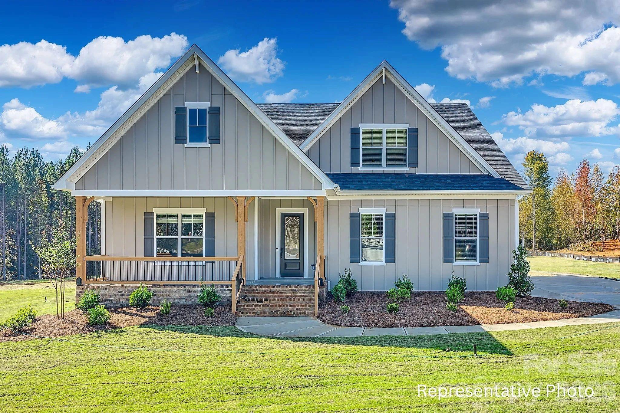 NEW CONSTRUCTION on a .5-acre homesite in lakefront Eastwind Cove! This Ranch-style home with an Upstairs Retreat features a stunning kitchen with floor-to-ceiling cabinetry, double wall oven, gas cooktop, walk-in pantry, and an oversized island overlooking the spacious family room. Family room includes a coffered ceiling and quad sliding doors leading to the covered rear deck. The Owner’s Suite showcases a dramatic 16' vaulted ceiling, along with two walk-in closets and a luxury bath featuring dual vanities and a large walk-in shower with both rain and hand-held shower heads. Upstairs retreat adds a generous bonus room with optional wet bar, plus a 4th bedroom and 3rd full bath. Community amenities include a pool and boat storage, with convenient access to multiple Lake Norman launch points. Home is scheduled to include over $50,000 in upgrades, and buyers still have time to make all selections from an extensive catalog offering multiple cabinet colors, quartz and granite options, hardwood flooring selections, stone fireplace surrounds, and a wide range of tile and structural upgrades. Photos are representative of previously built home of same plan, and may show options/upgrades not scheduled for this home but may be available.  Options, layouts, colors, etc in photos may differ from completed home.