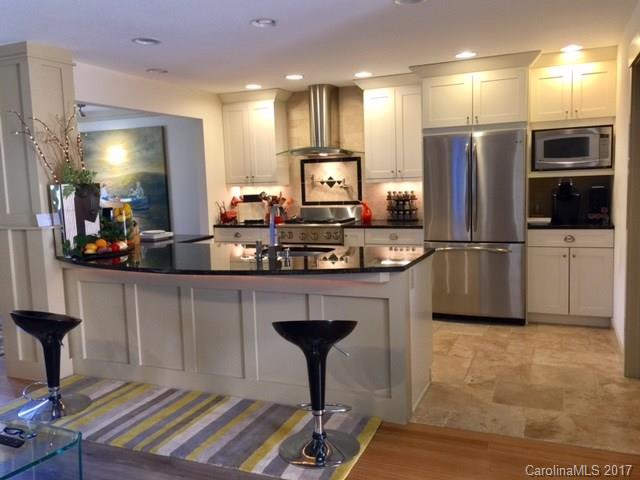 Beautiful totally remodelled one floor plan unit in popular Crowfields 55 and older community. Condo is like a brand new unit -  gutted and totally reconstructed with all the bells and whistles.  Now an open floor plan with top of the line kitchen (stainless appliances, granite, stove hood) dr and lr all one living space.  Covered porch was enclosed to create a beautiful sunroom/study area and more sf.  All new tile bathrooms, new hvac system with gas furnace.