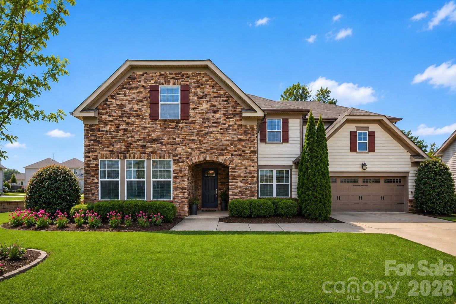 A rare turn-key opportunity offering luxury finishes, spacious living, and exceptional value. Located on a quiet cul-de-sac in one of the area’s most desirable communities, this beautifully upgraded home is loaded with custom features and thoughtful design throughout. Homes with this level of customization, condition, and attention to detail rarely hit the market at this price point.

Step inside to a stunning custom tile entryway that opens to a main level featuring hardwood floors, recessed lighting, and elegant crown molding. The living room showcases a custom lighted and wired built-in, creating the perfect focal point for relaxing or entertaining. A dedicated office with its own custom built-in provides a refined and functional workspace.

The beautifully refreshed kitchen features a large island and flows seamlessly into the main living areas, all equipped with surround sound that extends to the outdoor screened porch — ideal for entertaining and everyday living.

Upstairs, solid hardwood flooring continues throughout along with an oversized media room featuring custom projector wiring and integrated speakers, creating the ultimate home theater or entertainment space.

The luxurious primary suite is truly unforgettable, featuring a spa-inspired bathroom with floor-to-ceiling marble, a frameless glass shower, freestanding soaking tub, and radiant heated marble floors. Custom solid wood his-and-hers vanities with quartz countertops add both elegance and functionality, while separate custom closets and designer roller shades complete this exceptional retreat.

Additional highlights include a custom walk-in pantry and thoughtfully designed shelving and drawer systems throughout the home, offering exceptional organization and functionality.

Step outside to enjoy a private, fully fenced backyard featuring custom landscaping with plenty of space for kids to play ball, a paver patio, and a charming garden path — the perfect setting for relaxing evenings or entertaining guests. Situated on a peaceful cul-de-sac lot, the home offers added privacy and serenity. A full lawn irrigation system with additional drip lines keeps the grounds lush and vibrant year-round.

The community is loaded with amenities including a clubhouse, pool, tennis and basketball courts, walking trails, playground, and private boat launch access to Lake Wylie.

Don’t wait — come experience everything this exceptional home has to offer today!