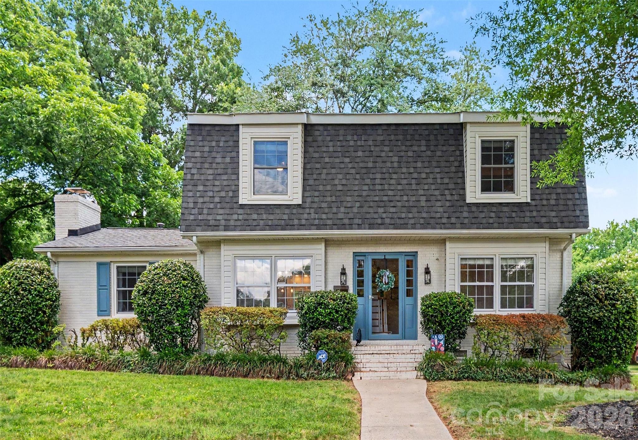 Nestled in one of Charlotte's most sought-after neighborhoods this beautifully maintained 2 story brick home offers timeless charm, exceptional curb appeal, and a private park-like setting on a corner lot. From the moment you arrive you will be captivated by the manicured landscaping, blooming azaleas and classic architecture that creates a warm & inviting home. This home is a RARE find in Beverly Woods boasting 4 bedrooms, 3 full baths and a detached 2 car garage.  Exterior of home was painted in 2021, Roof replaced on both house and garage in 2023. Flat roof on exterior enclosed porch was sealed in 2026. Kitchen was updated in 2024 with quartz countertops, new kitchen island, and new cabinetry.  Interior of the home has been freshly painted!  This home is MOVE IN READY !!