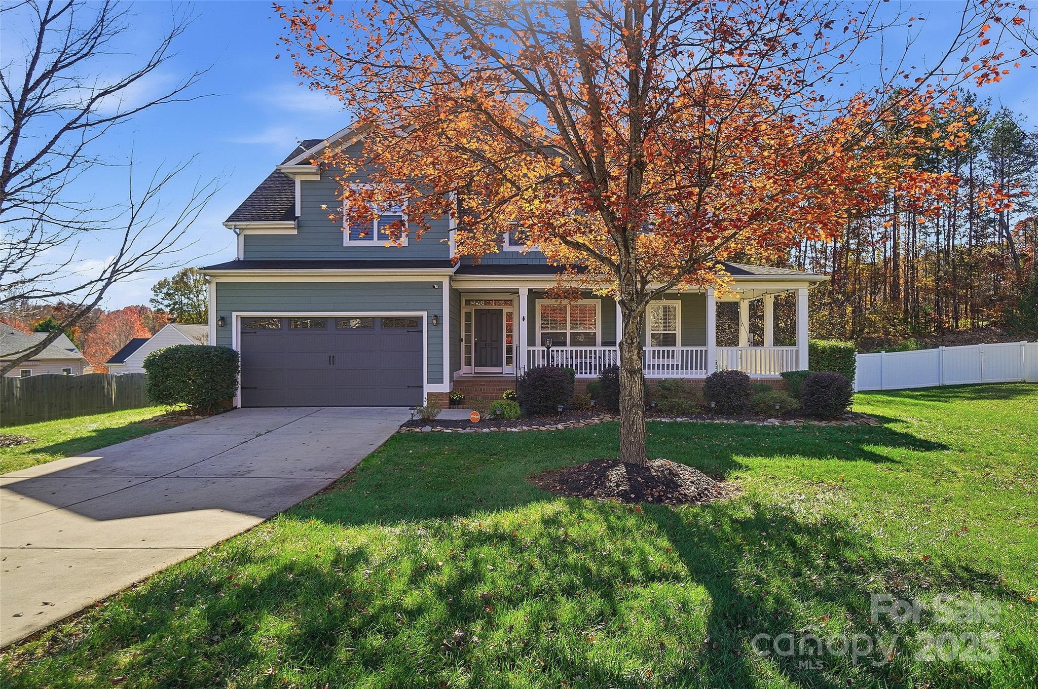 Welcome to 613 Adams Ridge, where charm, comfort, and thoughtful updates come together in one beautiful Fort Mill home. Tucked on a cul-de-sac and backing to trees, this 4-bedroom retreat greets you with a welcoming wraparound porch and an easy, comfortable flow throughout. The spacious family room, kitchen, and dining area create the heart of the home, just ideal for gathering, connecting, and everyday living. Step outside and feel the magic of true indoor–outdoor living. A large screened-in porch overlooks the heated in-ground pool and spa, while an additional laundry and half bath make pool days a breeze. Evenings are best spent around the peaceful wood-burning fireplace, creating the perfect backdrop for memories with family and friends. Upstairs, the serene primary suite and three additional bedrooms offer plenty of space to unwind. All set within the highly sought-after Fort Mill Schools district, this home blends warmth, functionality, and lifestyle in all the right ways!