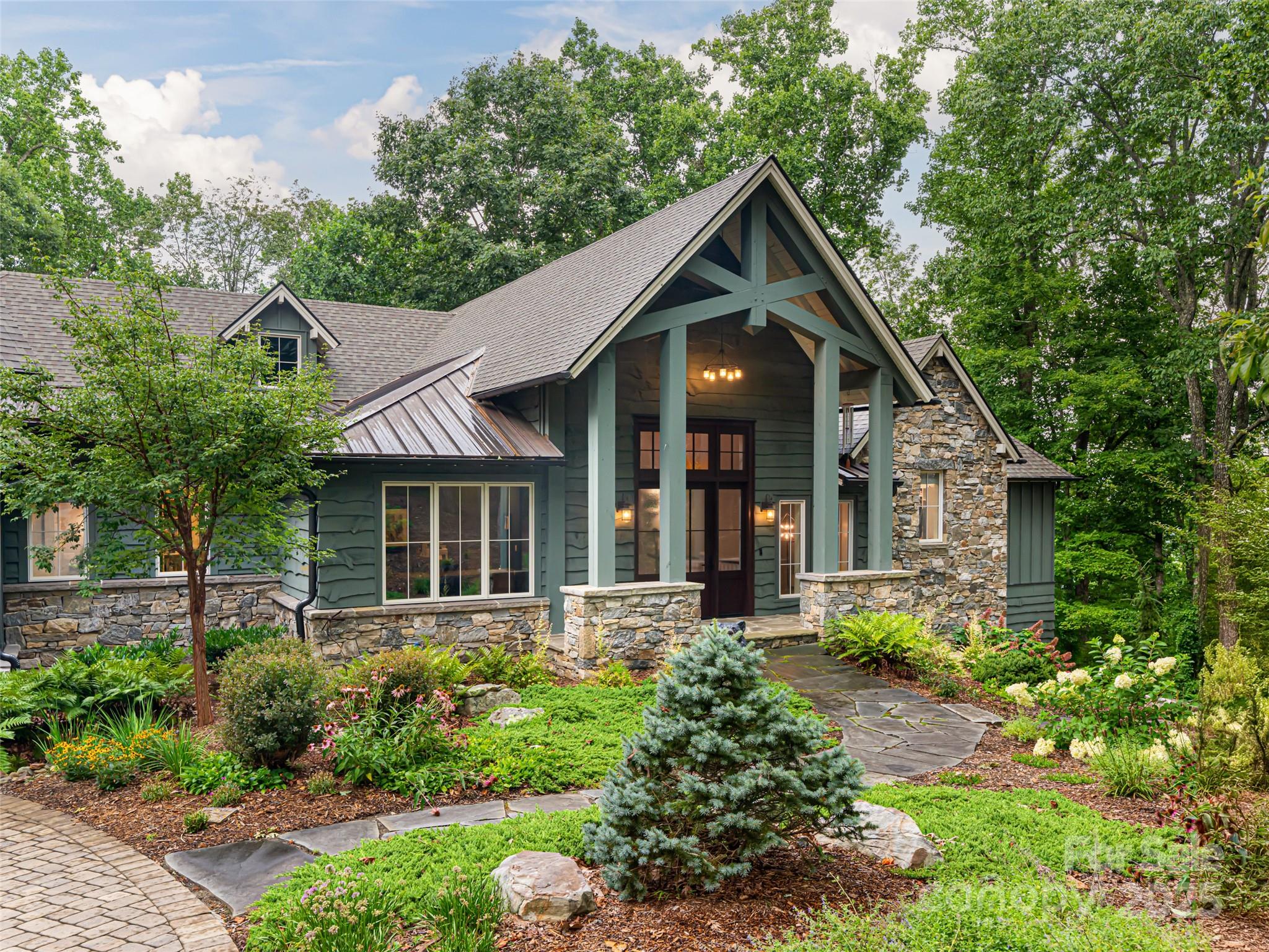 Best in Show 2020 Parade of Homes and Best Custom Home 2021 by the North Carolina Home Builders Association, this exquisite residence boasts breathtaking views all year round. Ideally located in the gated community of Pinchot Forest, it offers quiet privacy yet is only minutes from town. Designed for main level living, this unparalleled property offers seamless comfort and convenience. The open floor plan flows easily from the chef’s kitchen, which is the heart of the home, to the great room with soaring ceiling and exposed beams. The beautifully appointed primary suite and spa-inspired bath is your private respite at the end of the day. The terrace level is an entertainer's dream complete with a family room, bar, and epic theatre room. Three lovely ensuite bedrooms are perfect for hosting guests with style and sophistication. Come experience the ideal blend of mountain serenity and modern comfort.