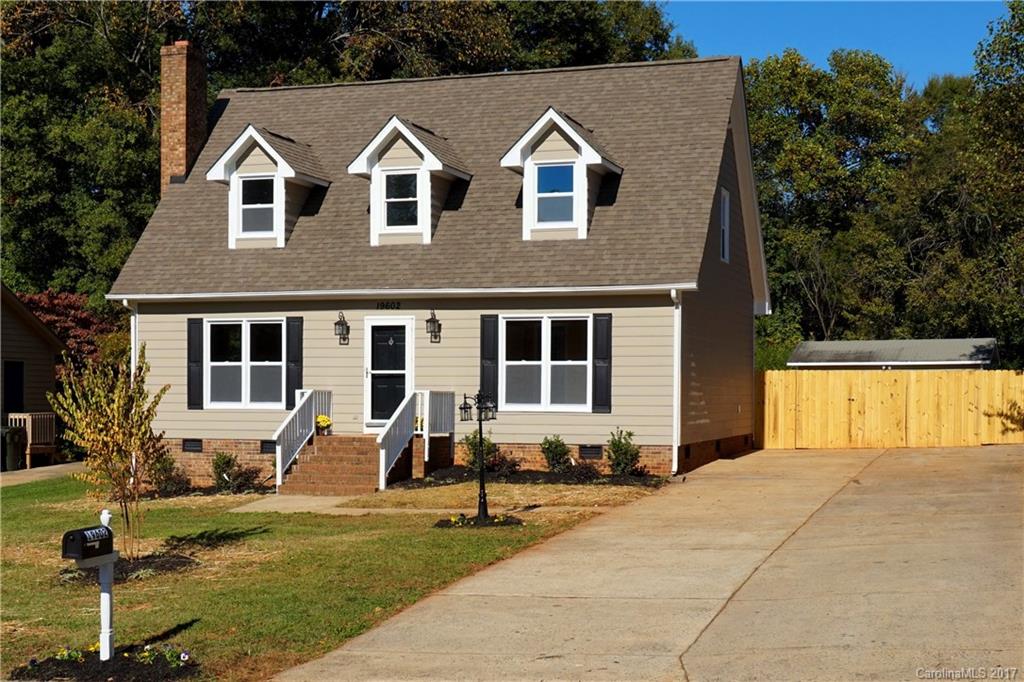 FULLY UPDATED & MOVE IN READY- 3 BR/ 2 BA home on an enormous, private, fenced lot of over 1/2 acre within walking distance of Antiquity and downtown Cornelius. All new vinyl windows. Laminate wood and tile flooring throughout 1st floor. Stainless appliances, refinished cabinets, and granite with mosaic backsplash in updated kitchen. New carpet and tile upstairs & fresh paint throughout. Large double driveway w/ room to add a garage, almost 400sf workshop/ shed and 12x20 deck for entertaining.