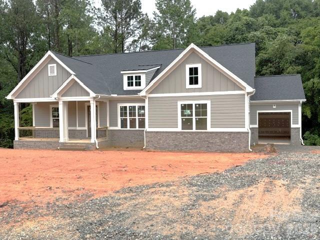 New construction in beautiful , sought-after Falls Cove neighborhood in Troutman.  The Tuscany floorplan is custom designed to flow nicely for entertaining & everyday living.  The main level features the Luxury Primary Suite that will not disappoint.  Plus, a second bedroom suite also on the main level.  Gourmet Kitchen with High End Appliances, large island & huge walk-in pantry.  A chef's delight with designer touches like stunning cabinets to the ceiling.  All flows effortlessly to the dining area & great room with Fireplace & custom built-ins.  Then out to the Rear Covered Porch & Open deck area for grilling.  A drop zone is just inside the 2-Car Garage Entrance.  Large Laundry Room has access to the 3rd Car Garage.  The Terrace level has 2 more oversized bedroom Suites and a Large Rec Room/Media Room.  Plus, lots of extra storage.  Private, Wooded backyard that backs up to HOA-Owned wooded common area for additional privacy.  Lots of designer upgrades planned throughout this unique & livable floorplan.
