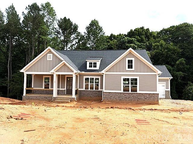 New construction in beautiful , sought-after Falls Cove neighborhood in Troutman.  The Tuscany floorplan is custom designed to flow nicely for entertaining & everyday living.  The main level features the Luxury Primary Suite that will not disappoint.  Plus, a second bedroom suite also on the main level.  Gourmet Kitchen with High End Appliances, large island & huge walk-in pantry.  A chef's delight with designer touches like stunning cabinets to the ceiling.  All flows effortlessly to the dining area & great room with Fireplace & custom built-ins.  Then out to the Rear Covered Porch & Open deck area for grilling.  A drop zone is just inside the 2-Car Garage Entrance.  Large Laundry Room has access to the 3rd Car Garage.  The Terrace level has 2 more oversized bedroom Suites and a Large Rec Room/Media Room.  Plus, lots of extra storage.  Private, Wooded backyard that backs up to HOA-Owned wooded common area for additional privacy.  Lots of designer upgrades planned throughout this unique & livable floorplan.
