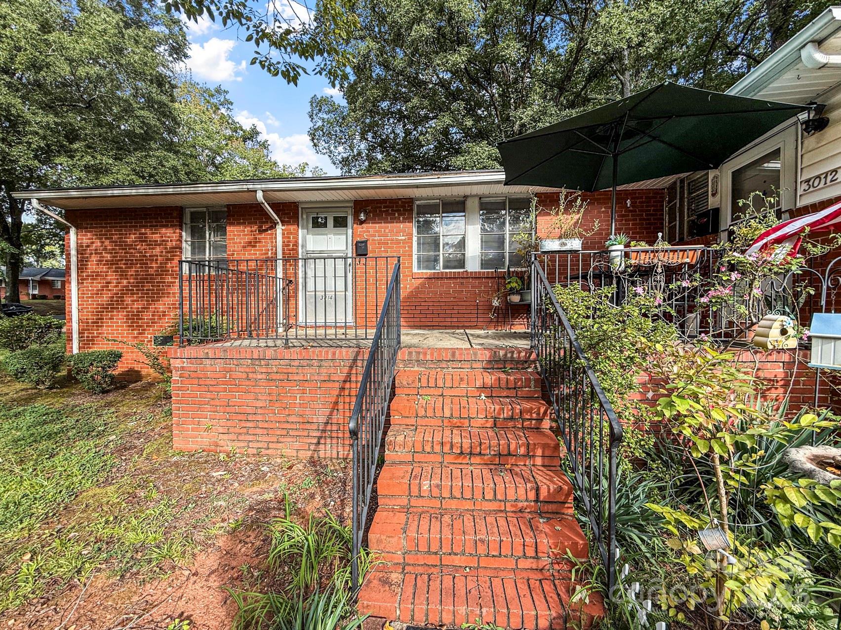 Welcome to 3014 Marlborough Road in Charlotte’s Ashley Park community just minutes west of Uptown—an affordable and versatile property that lives like a townhome or half duplex. This freshly updated home features new paint throughout, brand-new carpet in the bedrooms, and updated vents and fixtures, making it move-in ready for an owner-occupant or a hassle-free addition to an investment portfolio. Inside, you’ll find efficient living spaces with plenty of natural light, functional flow, and classic charm. The updates provide comfort and peace of mind, while the private driveway and HOA-maintained landscaping keep exterior upkeep simple. Located just minutes from Uptown Charlotte, Charlotte Douglas International Airport, and major highways, this property offers unbeatable convenience for commuting, shopping, and dining. With low HOA dues that include water and lawn care, residents and investors alike benefit from predictable monthly expenses. Whether you’re looking for an affordable first home or an investment with strong rental demand, this home delivers value and location. Investor Portfolio Note: This property is part of a larger investment portfolio and can be purchased individually or bundled with additional available units at a bulk discount for those seeking to scale their rental holdings.