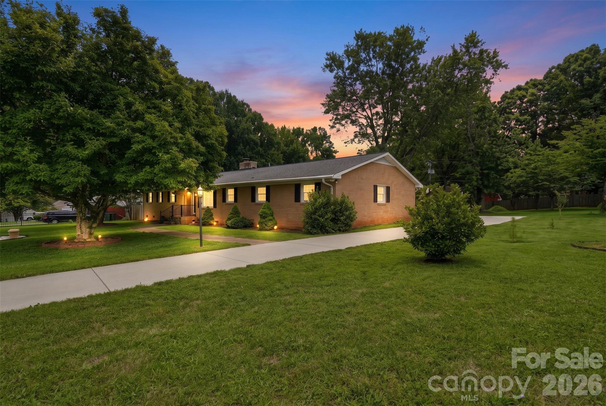 Situated on two large, private, and level lots totaling 1.12 acres, this exceptional property offers a rare combination of space, privacy, and convenience. Secured by a private gate, the home provides peace of mind and an elegant sense of arrival. A highly desirable rear-load two-car garage preserves the home's attractive curb appeal, while the expansive, fully fenced yard creates the perfect setting for both relaxation and entertaining. Enjoy outdoor living at its finest with a spacious covered porch featuring an outdoor kitchen and fireplace, ideal for gatherings year-round. Inside, you'll find a beautifully updated kitchen designed for both everyday living and effortless entertaining, along with two fully renovated bathrooms and four generously sized bedrooms offering flexibility for families, guests, or home office needs. Blending comfort, style, and functionality, this home delivers the best of both worlds—a tranquil private setting with convenient access to major highways, shopping, dining, and the vibrant energy of Uptown.