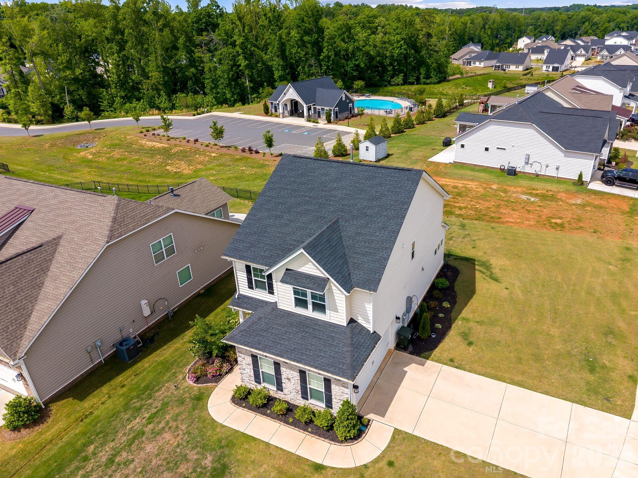 Welcome to 411 Hickory View Drive, a move-in-ready 3-bedroom home in Rock Hill offering the space and style buyers want without the wait for new construction. Built in 2023 and positioned on a desirable corner lot in Timberwood, this home features an open-concept layout, abundant natural light, a spacious primary suite, upper-level laundry, and a side-entry 2-car garage. The kitchen anchors the main living area with granite countertops, ample cabinetry, and a gas range ideal for everyday living and entertaining. Enjoy modern finishes, low-maintenance systems, and community amenities including a pool, all conveniently located near shopping, dining, and commuter routes. A smart opportunity for buyers seeking newer construction, functional design, and value in Rock Hill under $425K.
