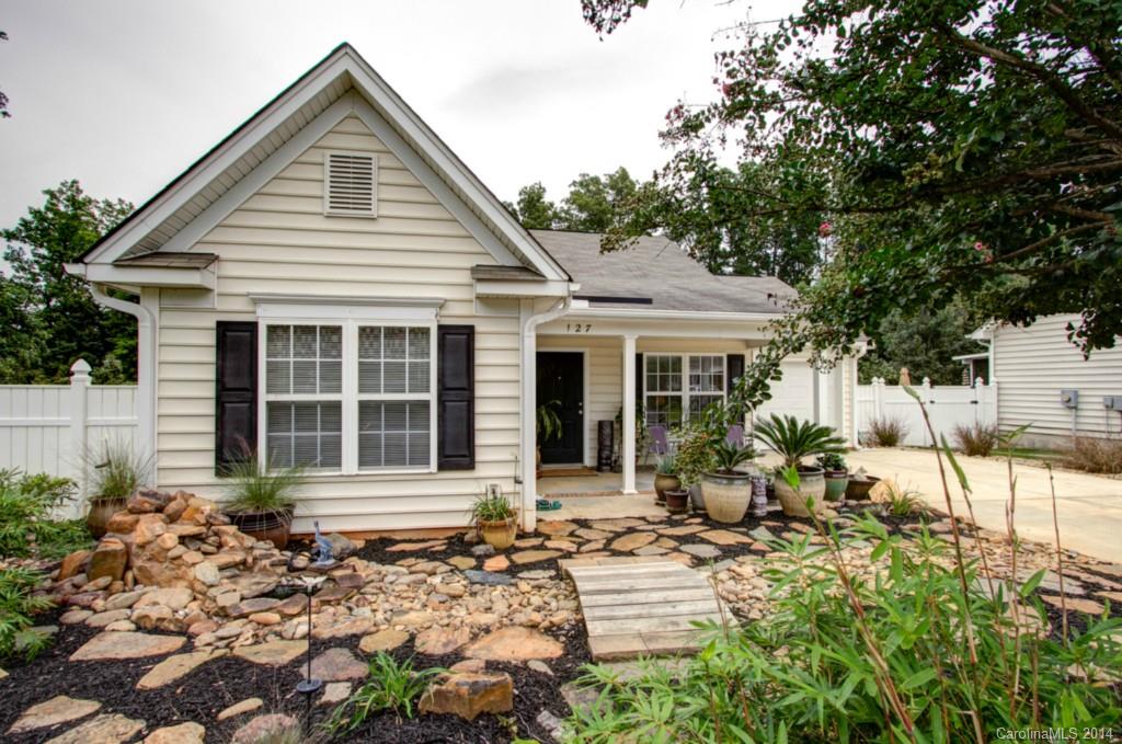 Outstanding ranch features tall ceilings,  kitchen with bar-island adjacent to the kitchen (great for entertaining). Breakfast nook off kitchen.  Master bedroom with walk-in closet and private bath.  Deck and patio backing to woods.  Private, fenced-in rear yard.  Included Refrigerator. Low-maintenance front yard. Close to downtown Mooresville. Move-in Ready. USDA 100% Financing Available for this property.