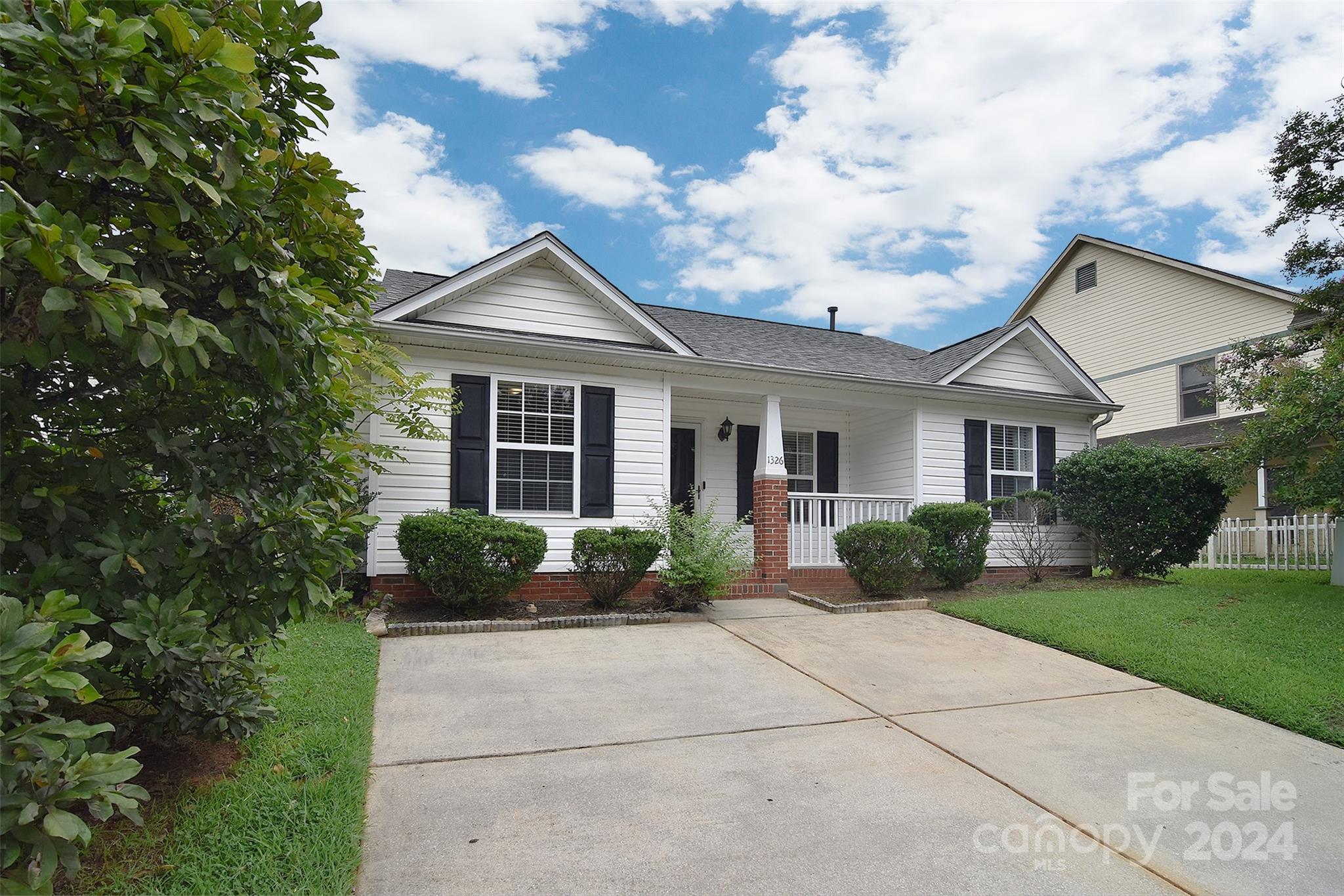 Don't miss this fantastic opportunity to own a single-story townhome in the Camellia Corners community. This 3 bedroom, 2 bathroom home offers a desirable split bedroom floorpan. The spacious living room is bright and open, perfect for entertaining. The Primary suite includes a vaulted ceiling, large walk-in closet and ensuite bathroom. The roof was replaced in 2024 along with newly installed leaf filter gutters. You will love relaxing on your front porch or on the back patio in your beautiful, large and private fenced-in back yard. Conveniently located near Dining, Shopping and growing Downtown Rock Hill. Schedule your tour today!