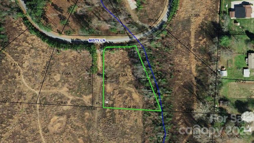 Large lot in the lakefront community of Whistle Peace. Seasonal lake views from just across the street. Most of lot is cleared meadow. Snow Creek, Arndt, St. Stephens school district. County taxes. Specific Architectural Restrictions.