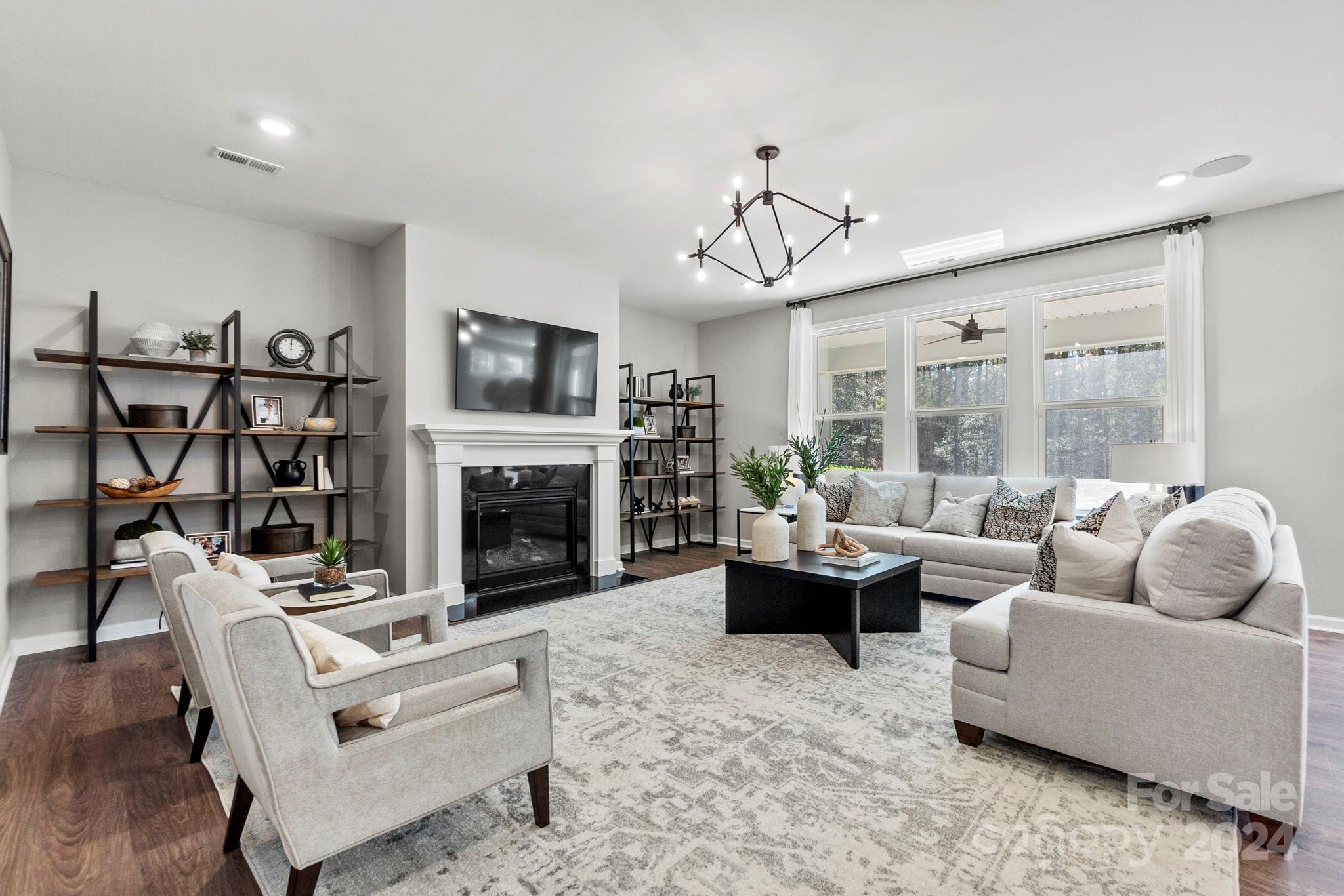 MLS#4171637  REPRESENTATIVE PHOTOS ADDED. September Completion! Meet the London—a home designed for luxurious living and effortless entertaining. The ground floor is an entertainer's dream, featuring an open-concept gathering room with a cozy fireplace, a stunning kitchen with a massive food-prep island and breakfast nook, a formal dining room, and ample storage, including a huge walk-in pantry, a butler’s pantry, coat closets, and a garage entry vestibule. Enjoy outdoor living on the screened porch, seamlessly blending indoor and outdoor relaxation. The spacious second story offers a loft, a game room, and four bedrooms, including a luxurious owner’s retreat designed as a true refuge, complete with dual vanities, two walk-in closets, an additional linen closet, a dedicated shower enclosure, a private enclosed commode, and a sumptuous soaking tub. Structural options added include: first floor guest suite, extended casual dining, bonus room, study, screened outdoor living, fireplace.