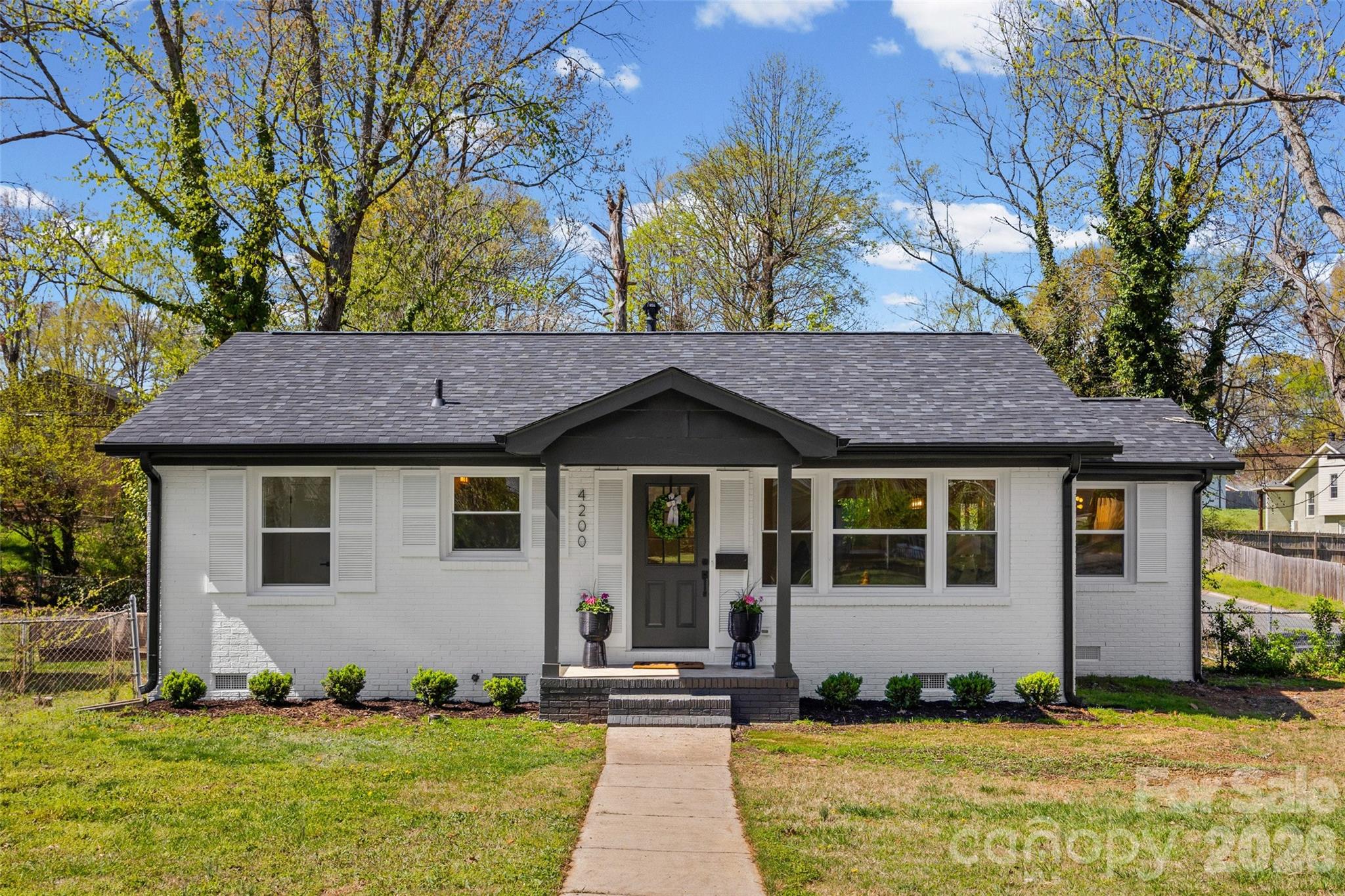 Now priced under $500k!! Best renovated brick ranch in Windsor Park in terms of value and renovation quality! Conveniently located minutes away from vibrant Plaza Midwood, Noda, Cotswold, Elizabeth and Uptown Charlotte. Step inside & be immediately impressed with all the bright natural light that fills the space & complements the new flooring, neutral paint & modern elevated finishes throughout. The open living area flows into a beautiful kitchen with quartz countertops, new Samsung stainless steel appliances, recessed lighting & a gas stove. The extra spacious primary suite makes this home stand out and is a rare find in this neighborhood! It features a large walk-in closet & a primary bath with tasteful tile work, double vanities & a generously sized walk-in shower. The home has two additional bedrooms & a 2nd updated bathroom. The back deck has been updated with touches like new ceiling, added structural support, a ceiling fan/lighting, it is a space that makes outdoor living enjoyable during multiple seasons. **This home was extensively renovated & no square inch was left untouched, including the core systems; new roof, new HVAC, full house electrical rewire and a new panel, new windows, floors, partial new plumbing and more**