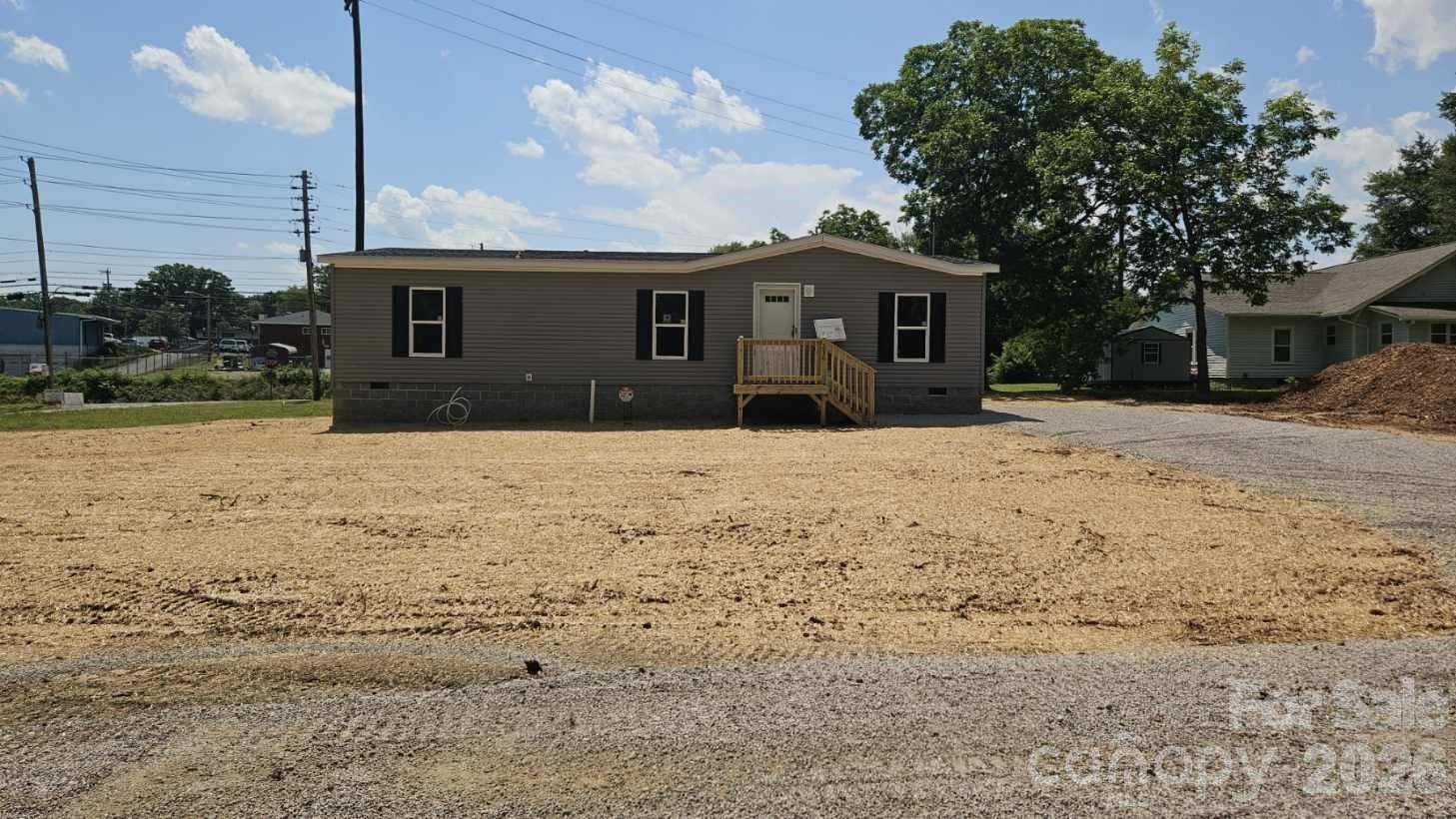 $15,000 Downpayment assistance available. USDA qualified Property. This Property is available with 100% financing and $15,000 downpayment assistance. Modern country living in Forest City. This brand-new 3 bedroom, 2 bath manufactured home is situated on approximately 0.3 acres and offers a spacious open floor plan with upgraded, modern finishes. The living room features a custom feature wall and flows into a well-appointed kitchen with a large center island, bar seating, coffee bar nook, 42" shaker cabinets, stainless steel range hood, Frigidaire stainless steel appliances and an oversized dining area. All bedrooms include walk-in closets, providing exceptional storage throughout. City water and sewer.  A great option for buyers seeking modern style, space and peaceful rural living.