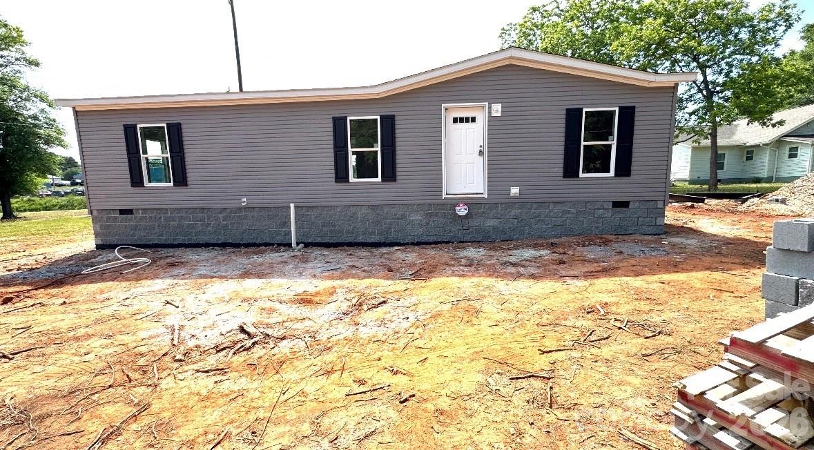 $15,000 Downpayment assistance available. USDA qualified Property. This Property is available with 100% financing and $15,000 downpayment assistance. Modern country living in Forest City. This brand-new 3 bedroom, 2 bath manufactured home is situated on approximately 0.3 acres and offers a spacious open floor plan with upgraded, modern finishes. The living room features a custom feature wall and flows into a well-appointed kitchen with a large center island, bar seating, coffee bar nook, 42" shaker cabinets, stainless steel range hood, Frigidaire stainless steel appliances and an oversized dining area. All bedrooms include walk-in closets, providing exceptional storage throughout. City water and sewer.  A great option for buyers seeking modern style, space and peaceful rural living.