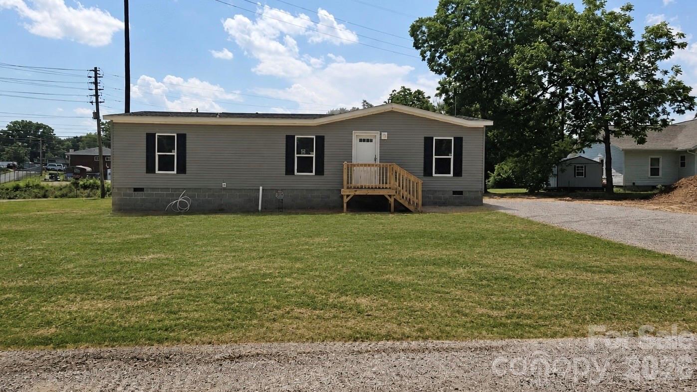 $15,000 Downpayment assistance available. USDA qualified Property. This Property is available with 100% financing and $15,000 downpayment assistance. Modern country living in Forest City. This brand-new 3 bedroom, 2 bath manufactured home is situated on approximately 0.3 acres and offers a spacious open floor plan with upgraded, modern finishes. The living room features a custom feature wall and flows into a well-appointed kitchen with a large center island, bar seating, coffee bar nook, 42" shaker cabinets, stainless steel range hood, Frigidaire stainless steel appliances and an oversized dining area. All bedrooms include walk-in closets, providing exceptional storage throughout. City water and sewer.  A great option for buyers seeking modern style, space and peaceful rural living.