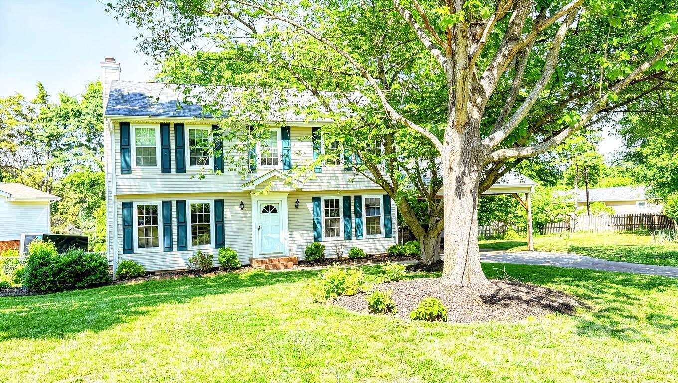 Are you looking for a fantastic South Charlotte home, a move-in ready gem with the ultimate freedom of NO HOA? Come see this beautiful Shadow Lake property today! From the moment you step inside, you will love the bright, freshly painted interior, beautifully refinished hardwood floors in the main living areas, and pristine, freshly cleaned carpets upstairs. The heart of the home features a large, open kitchen with classic white cabinets and a cozy breakfast area, alongside generously sized bedrooms and an abundance of storage with convenient pull-down attic stairs. Relax by the wood-burning fireplace (sold as-is) in the welcoming den, or step through the sliding glass doors onto your expansive wooden deck overlooking a fully fenced backyard—perfect for entertaining. Complete with updated baths featuring new vanities and tile flooring, a massive 11-foot tall 2-car carport ideal for larger vehicles, low-maintenance vinyl siding, and newer vinyl windows, this charming home truly has it all. Schedule your tour today and come see your new home in person!
