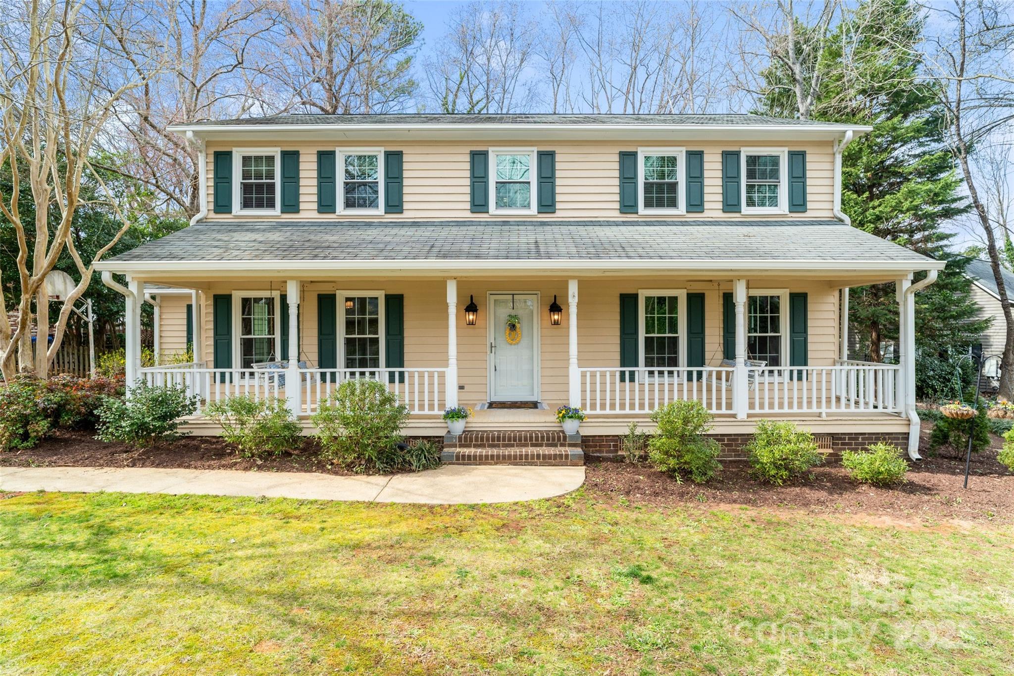 Traditional Farmhouse Style 4 Bedroom, 2.5 Bath Home in Shadowbrook, Rock Hill! Discover this charming home in a quiet neighborhood featuring multiple living spaces on the main level, including an open kitchen with an island and breakfast bar seating, a formal dining room, a formal living room, a cozy family room with a fireplace feature bookended by built-ins, and a bright sunroom overlooking the back yard. Head upstairs to find the primary suite and 3 additional generously sized bedrooms, room enough for family, guests, or hobbies. Situated on a beautiful tree-lined lot, spend mornings, afternoons, or comfortable evenings enjoying the surrounding serenity on your full front porch or open deck. Don't miss your chance to see this lovely home today!