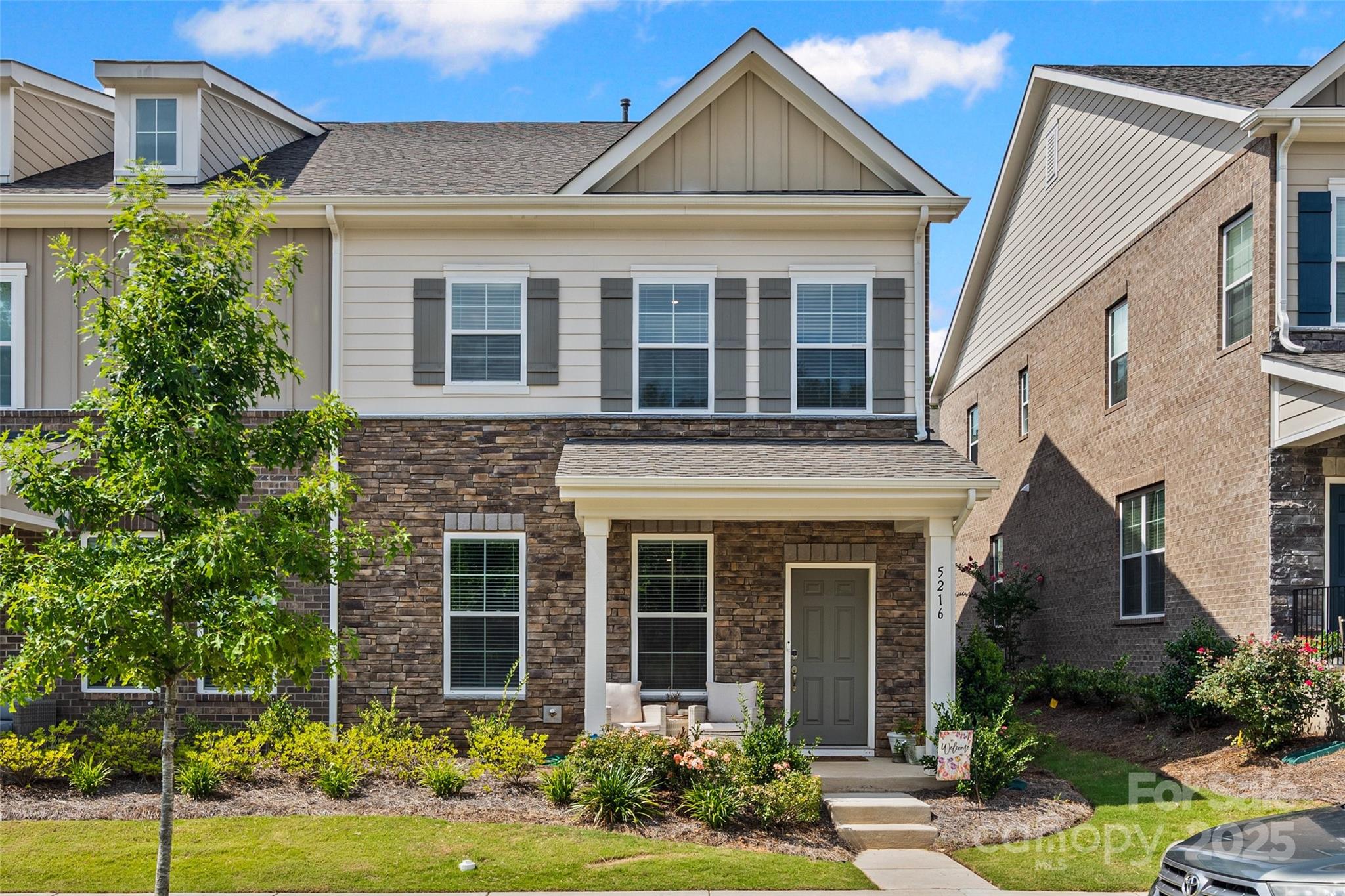 Beautiful End-Unit Townhome in McEwen Village! Built in 2023 this 3BR/2.5BA home offers modern living space with thoughtful upgrades throughout. Enjoy an open-concept main floor featuring a spacious kitchen with granite countertops, stainless steel appliances, under-cabinet lighting, and a 5-burner gas range. The great room and dining area are perfect for entertaining. Upstairs, the large primary suite includes two walk-in closets and a tray ceiling. All bedrooms feature walk-in closets, and the laundry is conveniently located on the upper level. 9-foot ceilings on both floors add to the home's open feel. 2-car rear-load garage with opener, durable fiber cement siding with stone accents, and in-ground irrigation. Community amenities include a fishing lake, walking trails, playground, and pocket park. Lawn maintenance included. Move-in ready!