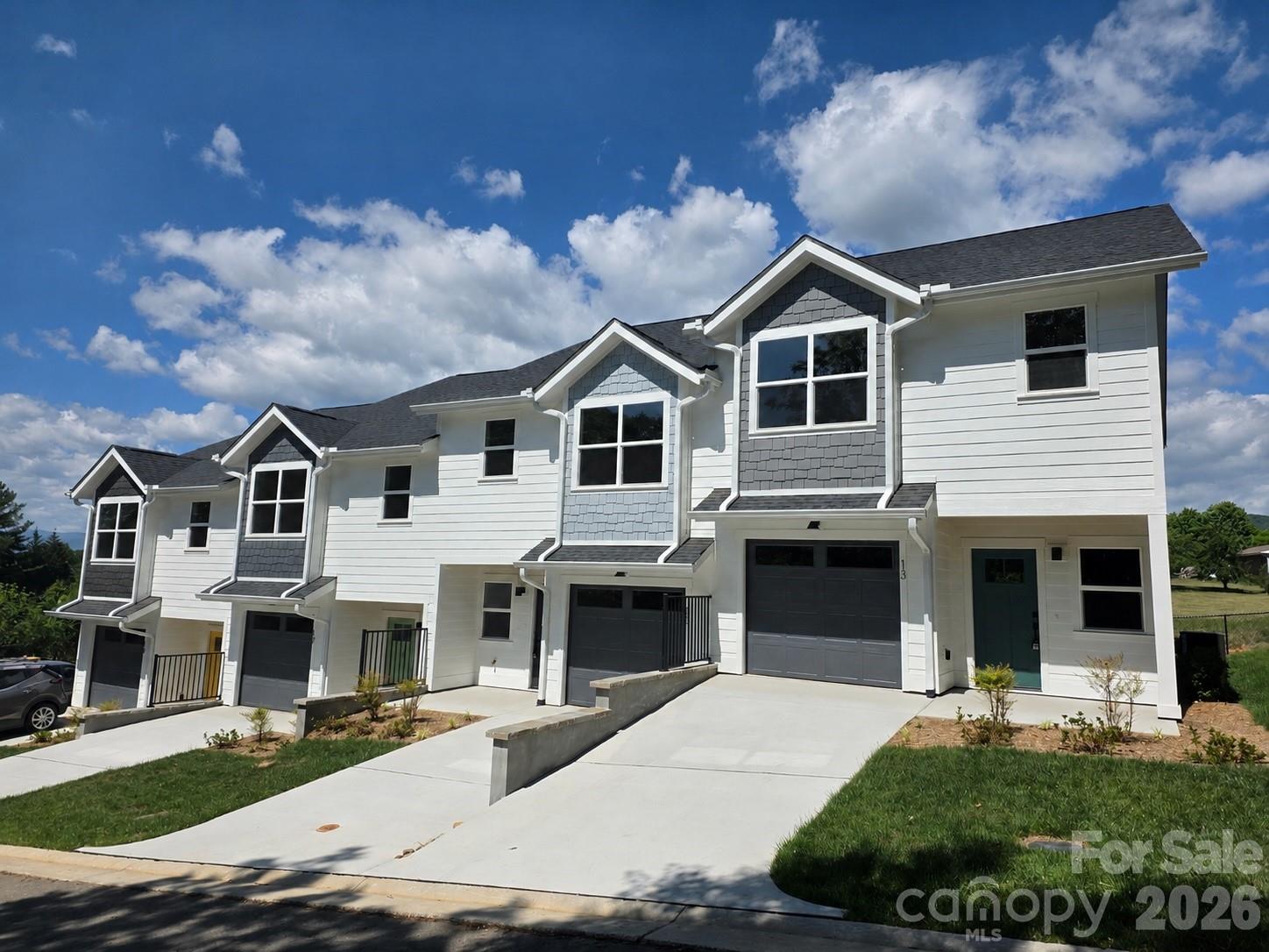 Discover West Asheville’s newest townhome community, Westview Village. Nestled amidst scenic rolling pastures just 4.3 miles from downtown Asheville. This exclusive collection of 26 thoughtfully designed townhomes offers modern living with luxury vinyl plank flooring, sleek chrome plumbing, and stylish contemporary lighting. The kitchens are beautifully appointed with stainless steel appliances, quartz countertops, and elegant cabinetry, blending functionality with sophistication. Each home features three bedrooms, two full bathrooms, and a half bath, providing a spacious living space. Lot 7 includes $5,970 in premium upgrades and offers exceptional value for this sought-after location."One Monthly Fee. Total Peace of Mind." The HOA takes care of general building maintenance, grounds maintenance, landscaping, snow removal, pest control, and more—so you can enjoy your home without the hassle. Virtual tour is of 5 Bolton (Model Unit) which is a similar layout to 13 Bolton.
