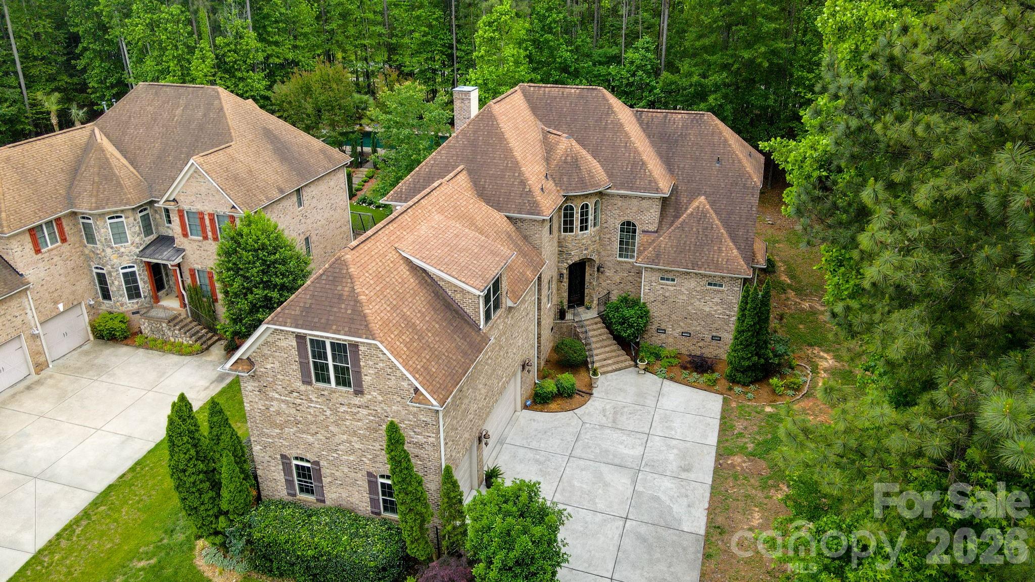 Custom Craftsmanship Meets Lakeside Lifestyle Where Timeless Elegance Meets Modern Shoreline Living.
Located in the highly sought-after Palm Tree Cove, 275 Palm Cove Way is a stunning full-brick and stone custom estate that balances grand architecture with the warmth of a true family sanctuary.  Situated just moments from the shores of Lake Wylie, this 3959-square-foot masterpiece offers a lifestyle of quiet luxury and community convenience.  Make a lasting first impression with the grand entry foyer that leads into a soaring two-story great room with cathedral ceilings, a grand gas fireplace, and French doors that open to a back deck for relaxation and solitude.  Bathed in natural light from a wall of windows, the living space features rich hardwoods that have recently been refinished, intricate exquisite crown moldings can be found throughout the home on ceilings and floors in every room, UV protected and black out Roman blinds, ensuring your home stays cool and your finishes stay pristine.  
Luxury is standard here, with a main-level primary suite featuring tray ceilings, panoramic bow windows, an exit door to the back deck, a garden tub with cathedral tray ceiling, massive walk-in shower and oversized walk-in closet space.  Upstairs, the layout is a dream for family or guests; each of the large bedrooms includes its own private full bath and a walk-in closet, offering a level of privacy rarely found in today’s market.  The kitchen is a chef’s delight with high end finishes, a massive island, custom cabinets, a walk-in pantry, stainless steel appliances and plenty of counter space for that holiday party or family gathering.  They say the kitchen is the heart of the home, and this one is no exception!  With an open floor plan, you can enjoy the guests mingling in the great room, while still keeping watch over your menu!  And if that’s not enough, there is also a formal dining room for those extra special occasions you want to remember.
This home comes equipped with a state-of-the-art security system securing all entry points and windows with 360-degree camera footage, as well as an irrigation system in the front and side yard.  The mature natural, sustainable, organic landscaping provides solitude and privacy that cannot be found in many new construction homes today, and includes: fig bush, rocks, trees, grass and evergreen ground cover. The tall, dry crawlspace allows for easy access to underneath the house, and there is over 1,200 sq-ft of storage space available in the attic with walk-in access doors to the attic from the bonus room.  
For the hobbyist or the adventurer, this home is unparalleled.  The oversized, tall 3-car garage is perfect for larger vehicles, while the community offers secure dedicated storage for boats, RV’s and jet skis.  Allison Park is just seconds down the road with public lake swimming, fishing piers, boat access (4 ramps), public soccer, football and pickleball fields.  After a day on the water, unwind on your low-maintenance Trex deck overlooking a private wooded backyard that is already perfectly sized for a future pool.  Enjoy the community pool, complete with picnic and recreational areas, and walking trails for the whole family.   Located in the award-winning Clover School District (including the new Lake Wylie High School), you have the best of both worlds; top-tier education and the benefit of low South Carolina property taxes.  Just a short commute to Charlotte Douglas International Airport and Downtown Charlotte, quaint restaurants and every day shopping.  
From the central vacuum system to the brand-new 2025 hot water heater and new windows, no detail has been overlooked.  275 Palm Cove Way isn’t just a move – it’s an ARRIVAL! Whether you are a lake enthusiast or a lover of fine craftsmanship, this home is the rare find you’ve been waiting for.  If you are looking for a top quality house at an amazing price, come see this one for yourself and call it HOME!