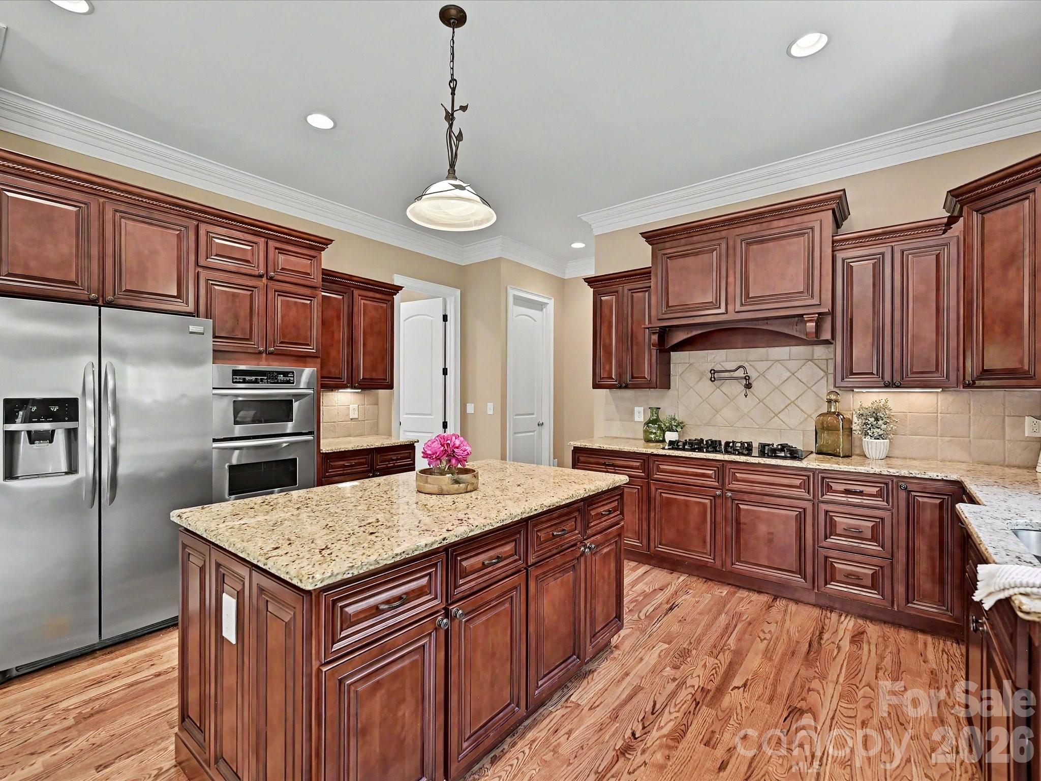 Custom Craftsmanship Meets Lakeside Lifestyle Where Timeless Elegance Meets Modern Shoreline Living.
Located in the highly sought-after Palm Tree Cove, 275 Palm Cove Way is a stunning full-brick and stone custom estate that balances grand architecture with the warmth of a true family sanctuary.  Situated just moments from the shores of Lake Wylie, this 3959-square-foot masterpiece offers a lifestyle of quiet luxury and community convenience.  Make a lasting first impression with the grand entry foyer that leads into a soaring two-story great room with cathedral ceilings, a gas fireplace, and French doors that open to a back deck for relaxation and solitude.  Bathed in natural light from a wall of windows, the living space features rich hardwoods that have recently been refinished, intricate exquisite crown moldings can be found throughout the home on ceilings and floors in every room, UV protected and black out Roman blinds, ensuring your home stays cool and your finishes stay pristine.  
Luxury is standard here, with a main-level primary suite featuring tray ceilings, panoramic bow windows, an exit door to the back deck, a garden tub with cathedral tray ceiling, massive walk-in shower and oversized walk-in closet space.  Upstairs, the layout is a dream for family or guests; each of the large bedrooms includes its own private full bath and a walk-in closet, offering a level of privacy rarely found in today’s market.  The kitchen is a chef’s delight with high end finishes, a massive island, custom cabinets, a walk-in pantry, stainless steel appliances and plenty of counter space for that holiday party or family gathering.  They say the kitchen is the heart of the home, and this one is no exception!  With an open floor plan, you can enjoy the guests mingling in the great room, while still keeping watch over your menu!  And if that’s not enough, there is also a formal dining room for those extra special occasions you want to remember.
This home comes equipped with a state-of-the-art security system, securing all entry points and windows with 360-degree camera footage, as well as an irrigation system in the front and side yard.  The mature natural, sustainable, organic landscaping provides solitude and privacy that cannot be found in many new construction homes today, and includes: fig & blueberry bushes, rocks, trees, grass and evergreen ground cover. The tall, dry crawlspace allows for easy access to underneath the house, and there is over 1,200 sq-ft of storage space available in the attic with walk-in access doors to the attic from the bonus room.  
For the hobbyist or the adventurer, this home is unparalleled.  The oversized, tall 3-car garage is perfect for larger vehicles, while the community offers secure dedicated storage for boats, RV’s and jet skis.  Allison Park is just seconds down the road with public lake swimming, fishing piers, boat access (4 ramps), public soccer, football and pickleball fields.  After a day on the water, unwind on your low-maintenance Trex deck overlooking a private wooded backyard that is already perfectly sized for a future pool.  Enjoy the community pool, complete with picnic and recreational areas, and walking trails for the whole family.   Located in the award-winning Clover School District (including the new Lake Wylie High School), you have the best of both worlds; top-tier education and the benefit of low South Carolina property taxes.  Just a short commute to Charlotte Douglas International Airport and Downtown Charlotte, quaint restaurants and everyday shopping.  
From the central vacuum system to the brand-new 2025 hot water heater and new windows, no detail has been overlooked.  275 Palm Cove Way isn’t just a move – it’s an ARRIVAL! Whether you are a lake enthusiast or a lover of fine craftsmanship, this home is the rare find you’ve been waiting for.  If you are looking for a top-quality house at an amazing price, come see this one for yourself and call it HOME!