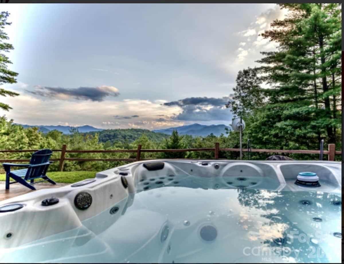 You’ve been waiting for the right property in the right community. This is it. Lookout Lodge sits on 4.32 private acres within Fontana Lake Estates — one of Western North Carolina's most exclusive gated communities, where properties regularly trade between $1M and $3M. At $950,000, this custom Yankee Barn Home represents a rare opportunity to enter this enclave at the lower end of the market, without compromising on the views, craftsmanship, or privacy that define it. Perched atop Nantahala Ridge, the home delivers west-facing, long-range views of the Great Smoky Mountains that are as dramatic in January as they are in October. Post-and-beam architecture, exposed timber beams, soaring ceilings and a great room fireplace were designed to frame that view from every angle. The property lives large: 3 BRs, 3 baths, a main level primary suite, upper loft bedrooms and an unfinished walkout basement — plus a 3-car garage. Outside, a private spa/hot tub, fire pit and screened deck make this a four-season retreat in the truest sense. No neighbors in sight. Currently operating as a successful STR, Lookout Lodge is a turnkey income producer — or the personal mountain legacy home you've been waiting for. Community amenities include gated access, Fontana Lake access, walking trails and picnic areas. Charlotte: 2.5 hrs. Asheville: 1 hrs. Atlanta: 2.5 hrs. Downtown Bryson City, the Nantahala River and Great Smoky Mountains National Park are minutes away.