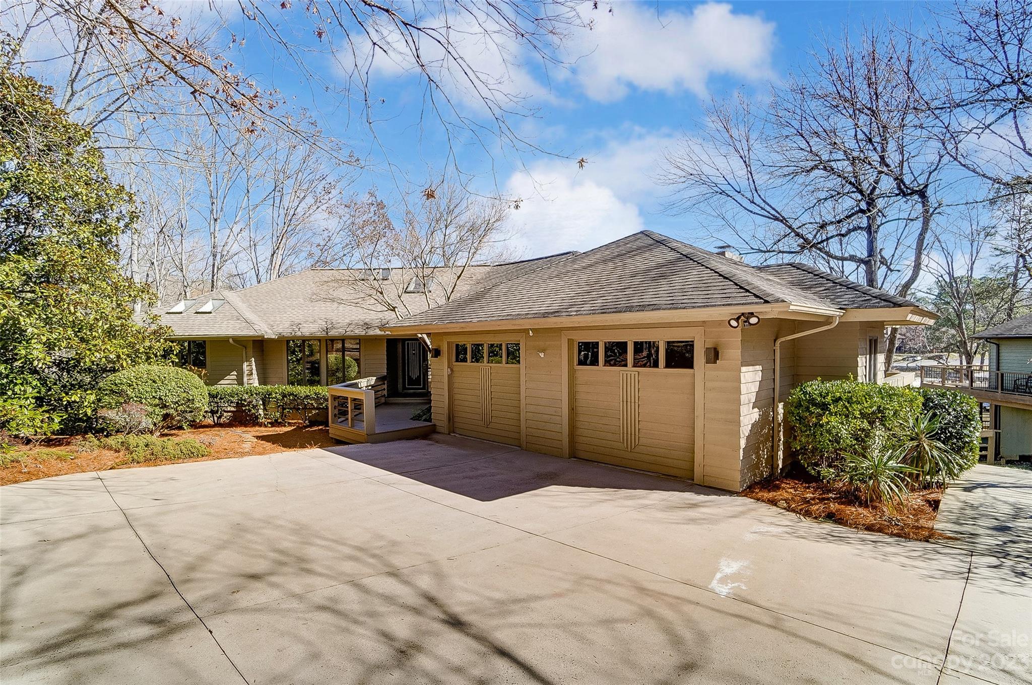 Fantastic opportunity to own a Waterfront ranch, w/walkout basement, nestled in the gated community of River Hills. This home has tons of personality, massive decks, swimming pool, hot tub & is a quick walk to the community marina, playground & gardens! The bright & open floor plan boasts amazing great room w/ fireplace & wall of windows to take in the serene lake views.  Dining room w/ wet bar is perfect for entertaining. Spacious eat-in kitchen features double ovens, center island, & walk-in pantry opening to den w/ fireplace. Main level Primary Suite w/ access to private deck, walk-in closet, bath w/ jetted tub, & dual vanities. 2nd bedroom on main or continue to use it as a home office.  Lower level provides 2 bedrooms, 2 full baths, bonus room, storage, & rec room providing lots of flex space.  Award-winning Clover Schools, SC taxes, convenient to restaurants & shopping. River Hills Marina & Country Club require separate memberships offering golf, tennis, pickle ball, and pools.