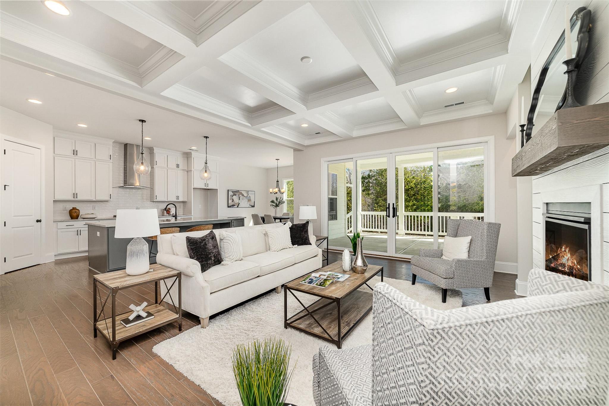This MOVE IN READY, NEW CONSTRUCTION home sits on 1+ acre & offers an open floor plan designed to connect indoor & outdoor living. The large family room features quad sliding doors leading to back porch and a vaulted 16' ceiling in the owner's suite. The kitchen includes double wall ovens, gas cooktop, a spacious walk-in pantry, and oversized island. The owner's bath impresses with dual walk-in closets, and a luxurious walk-in shower with rain & handheld showerheads. Upstairs retreat adds a bedroom, full bath, and bonus room with wet bar & wine fridge. The encapsulated, conditioned crawl space enhances energy efficiency, and the larger homesite offers room for outdoor additions. Located in Edmunds Farm, the home combines privacy with proximity to conveniences, including Historic Downtown Clover just minutes away, and activities at Lake Wylie and two state parks are ~15 minutes away.