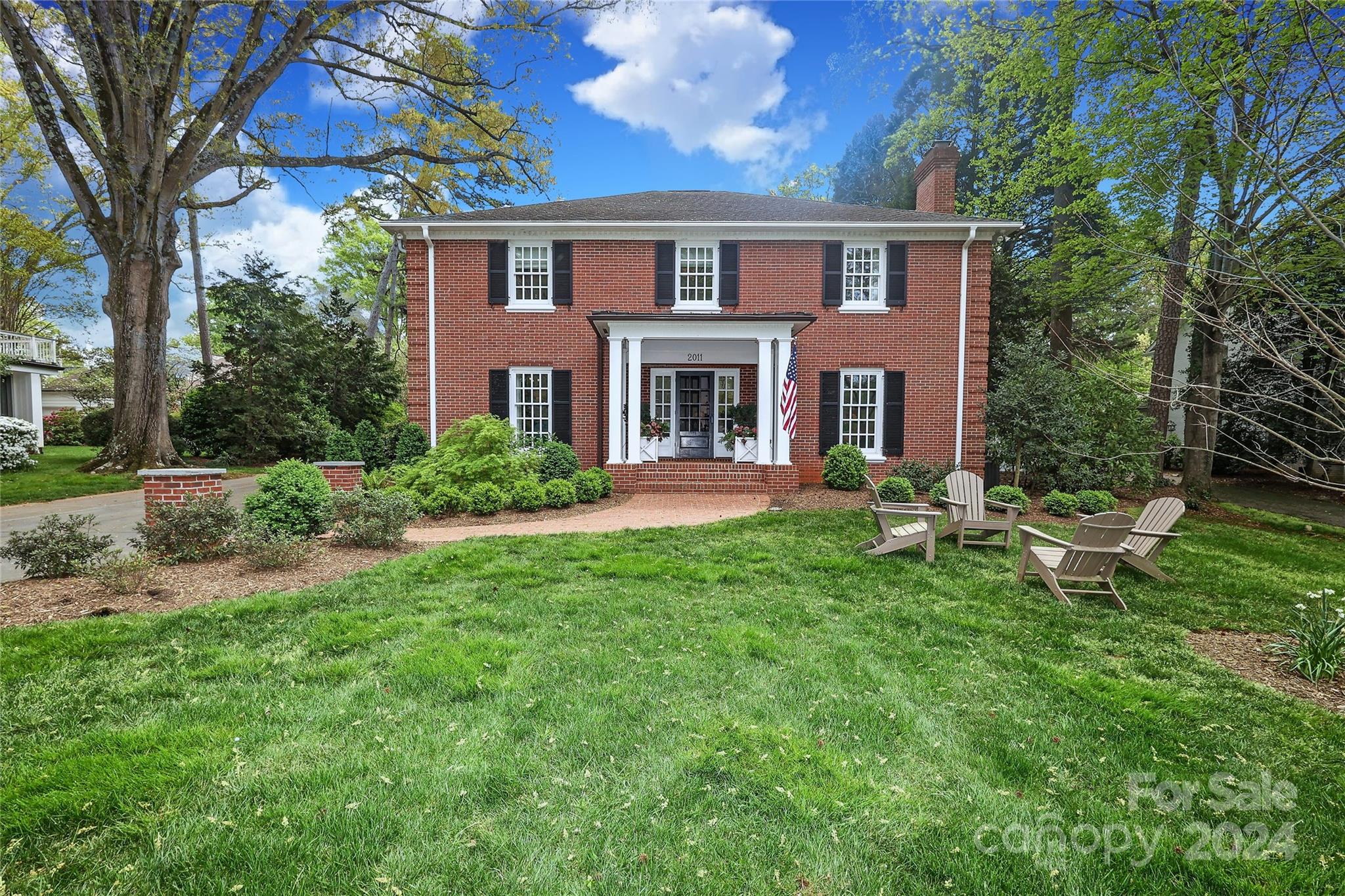 Beautiful classic home w/ an ageless layout abounds w/ charm in the heart of Charlotte! To add to the charm, the home is near the end of a cul de sac in a neighborhood w/ no cut thru streets. Home displays hardwood floors, a cozy Den & a large Living Room, both w/ wood burning fireplaces. Kitchen is adjacent to a covered porch & has a large island, walk-in pantry, beautiful painted cabinetry, stainless appliances & breakfast area. Kitchen opens to   Family Room flooded by natural light & an intimate Dining Room that is a perfect place for entertaining! Family Room opens to an inviting large Screened Porch & Patio. 5 large Bedrooms w/ 3 Bathrooms & a Screened Porch off Primary Bedroom are on 2nd floor level. Heated & cooled Basement w/ interior stairs offers many options.  Exterior presents 2 screened Porches, a brick Patio w/ Fire Pit & a flat .55 acre lot w/ amazing landscaping. 2 car Carport w/ Storage Area. Expansive driveway area provides great areas for outdoor fun! Home is a gem!
